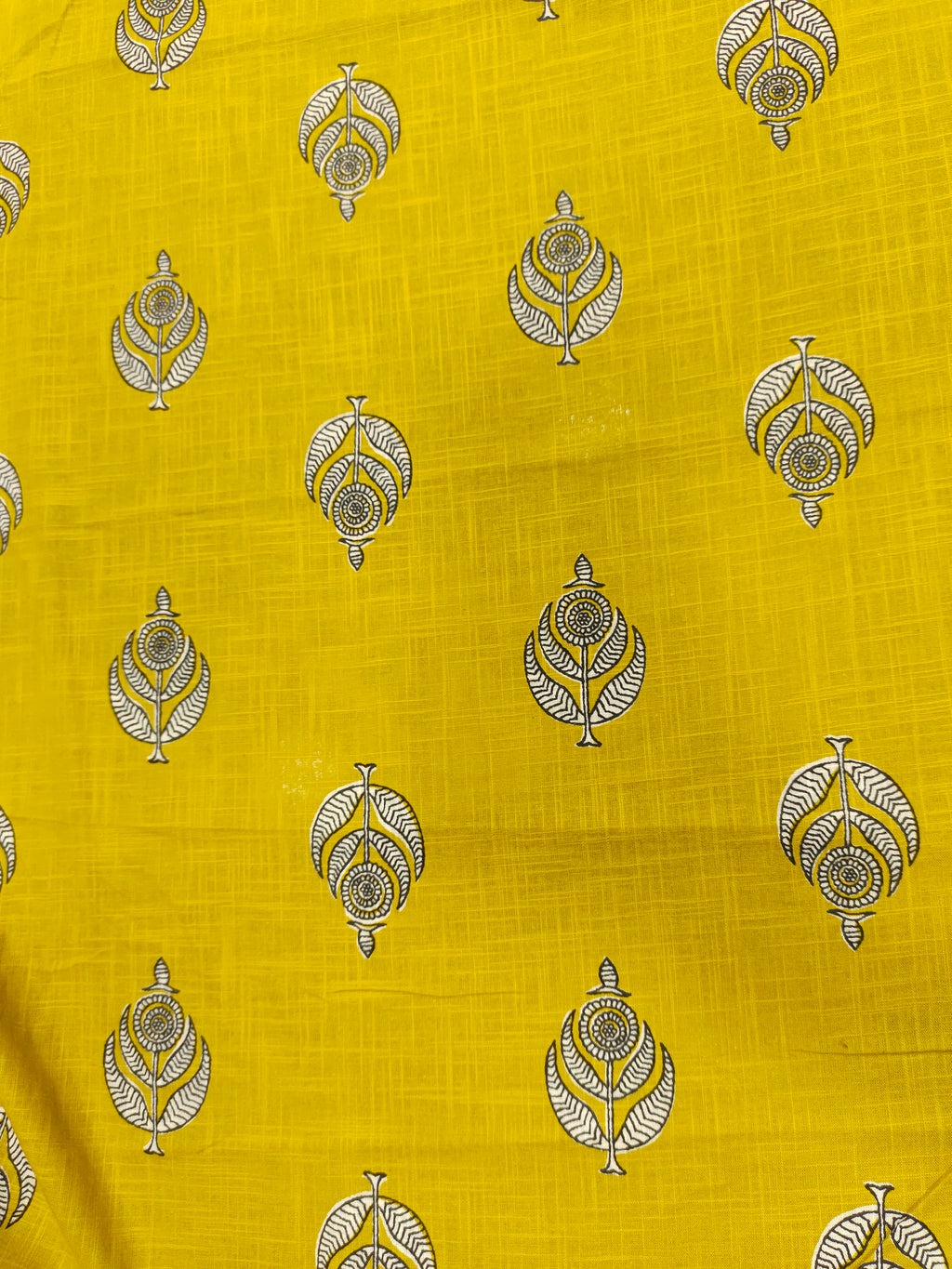 Yellow cotton slub print with black and white motif print.