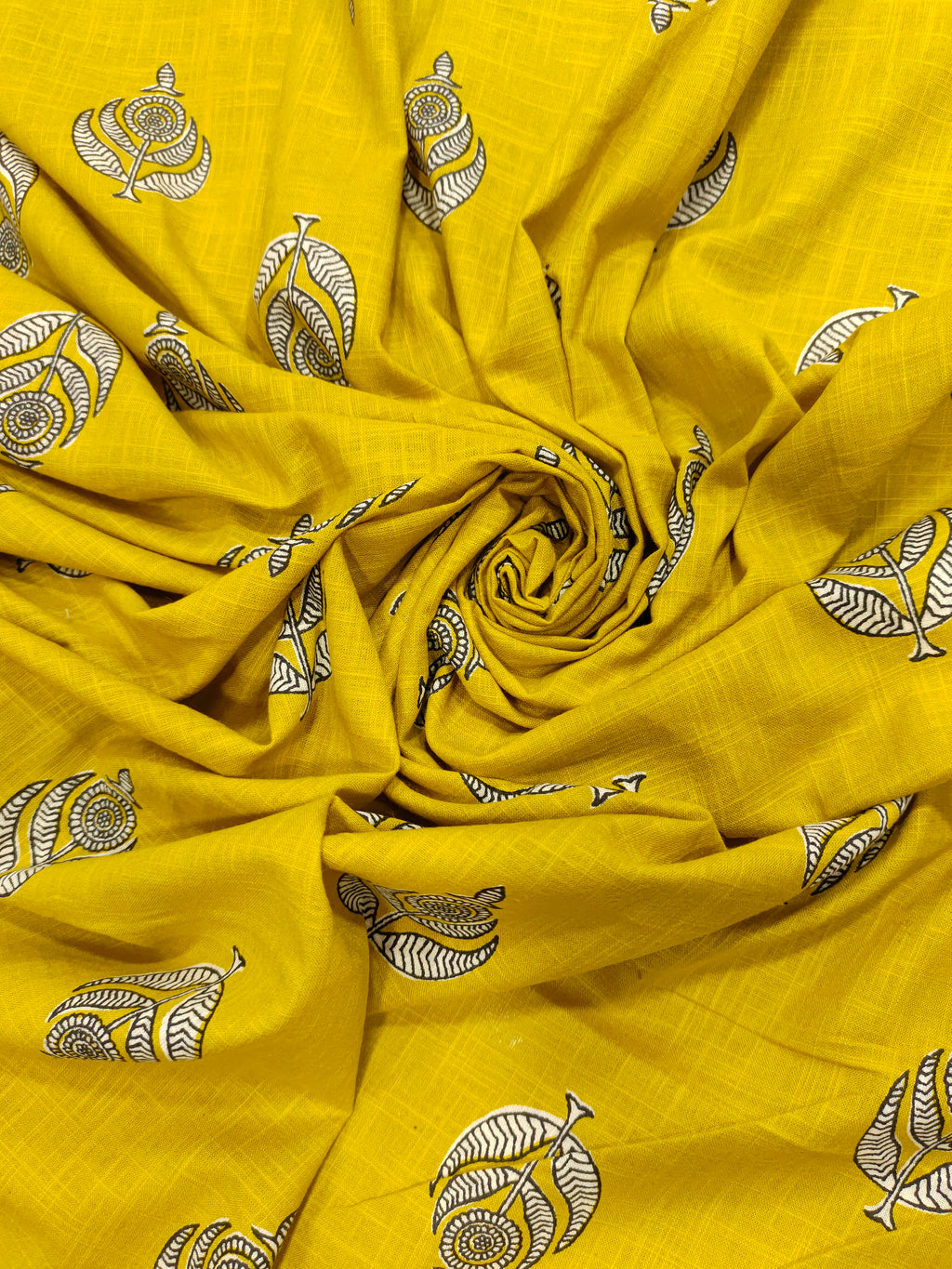 Yellow cotton slub print with black and white motif print.