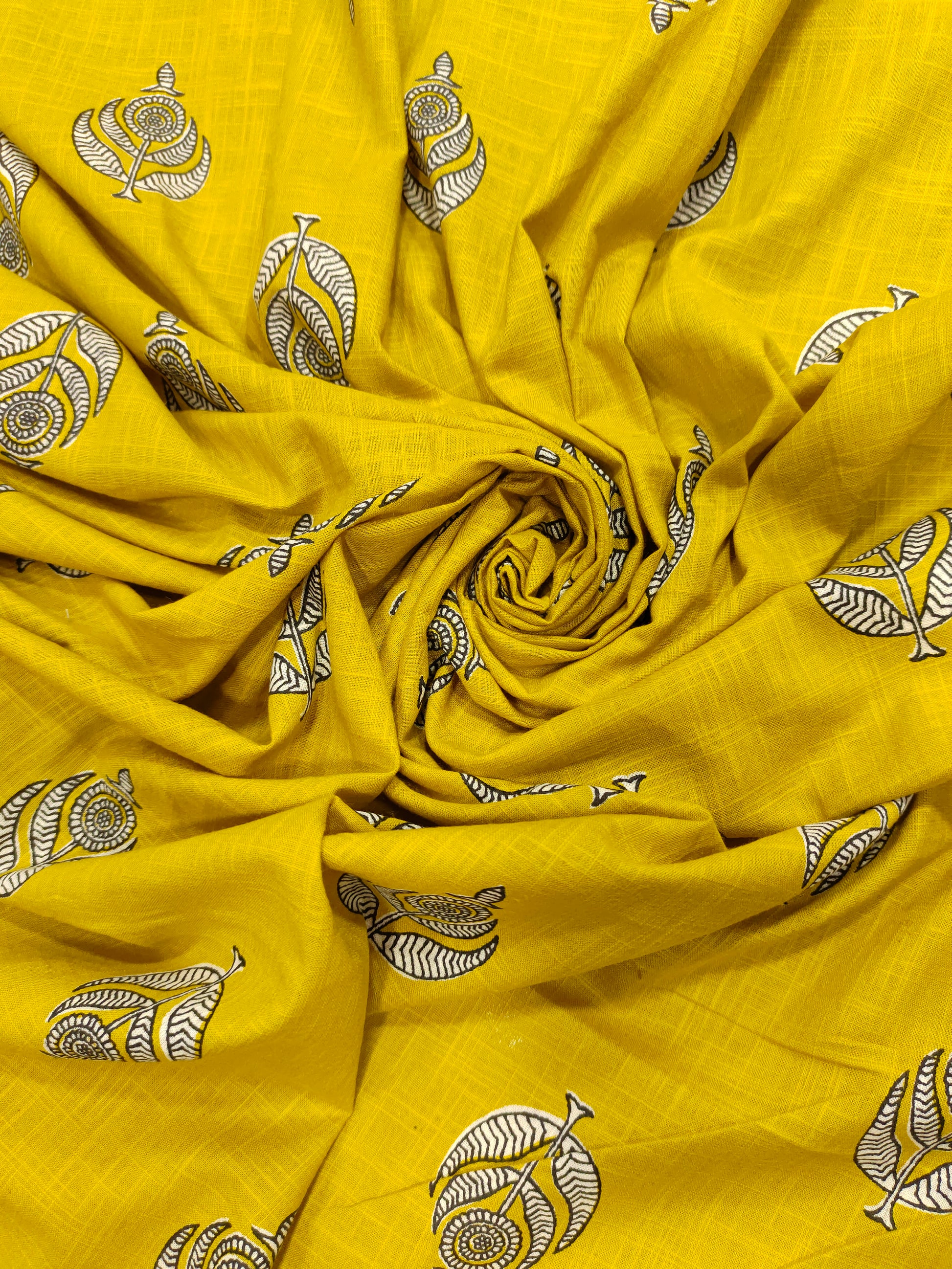 Yellow cotton slub print with black and white motif print.