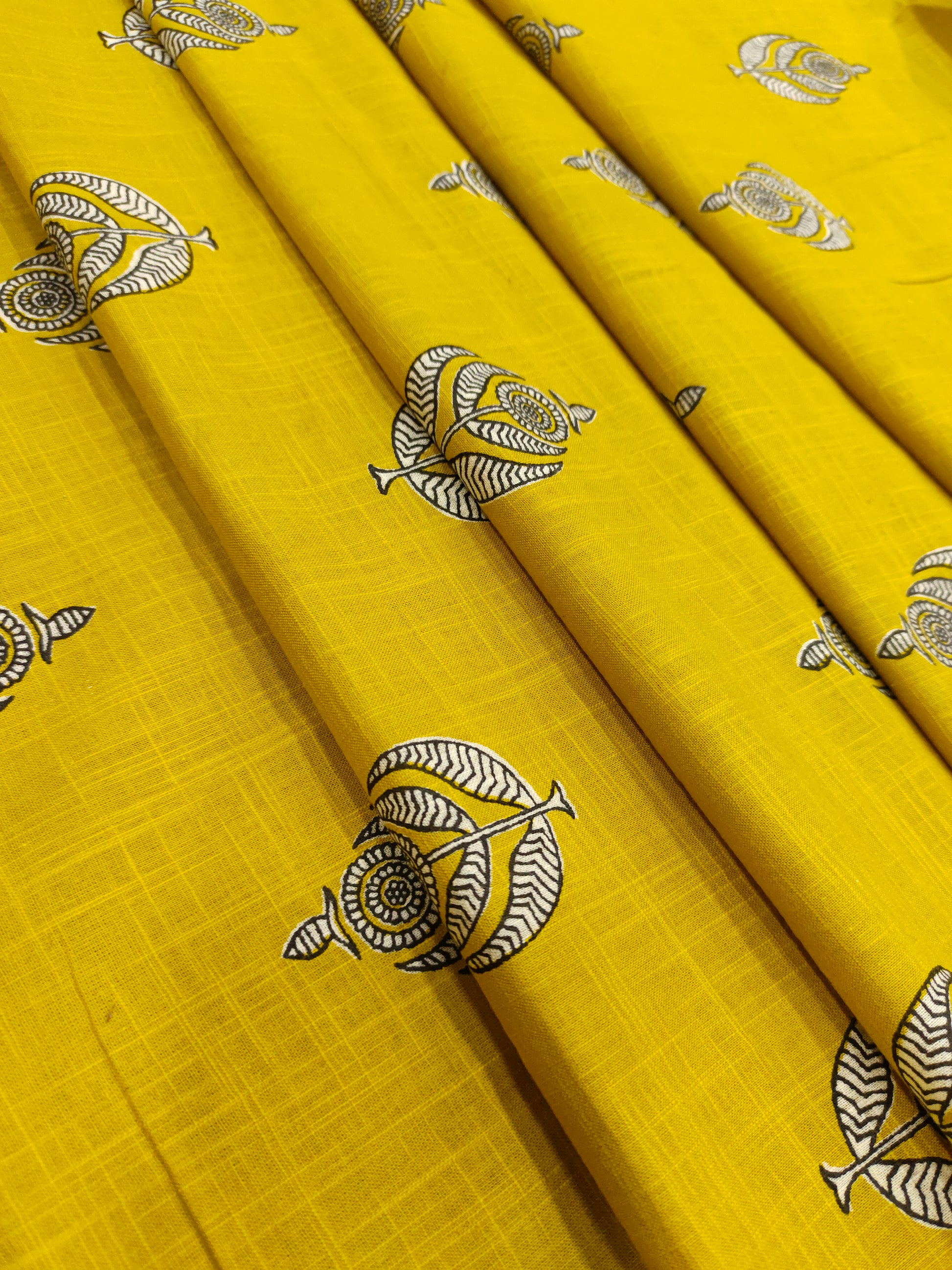 Yellow cotton slub print with black and white motif print.