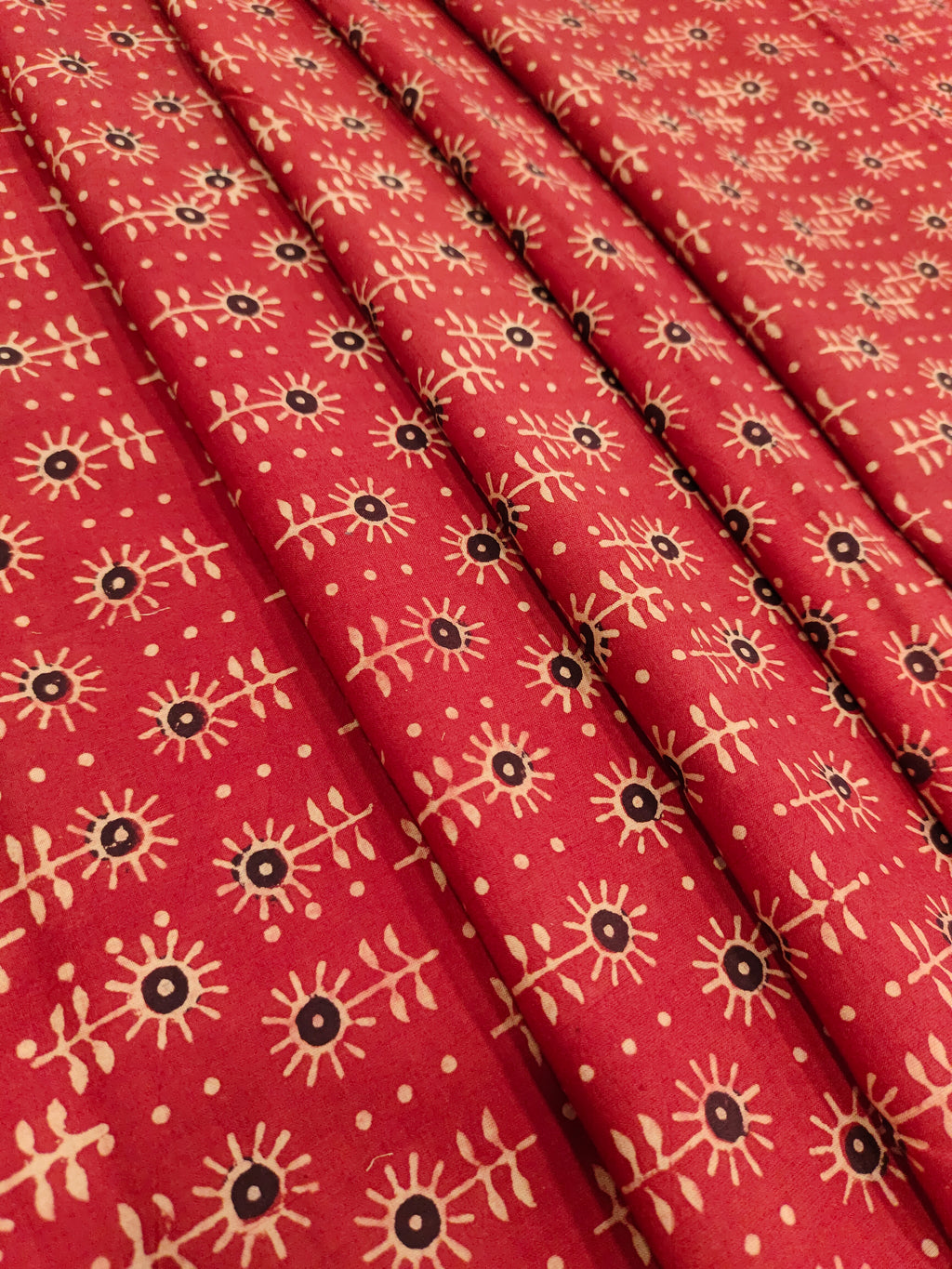 Maroon cotton ajrak print with black and beige.