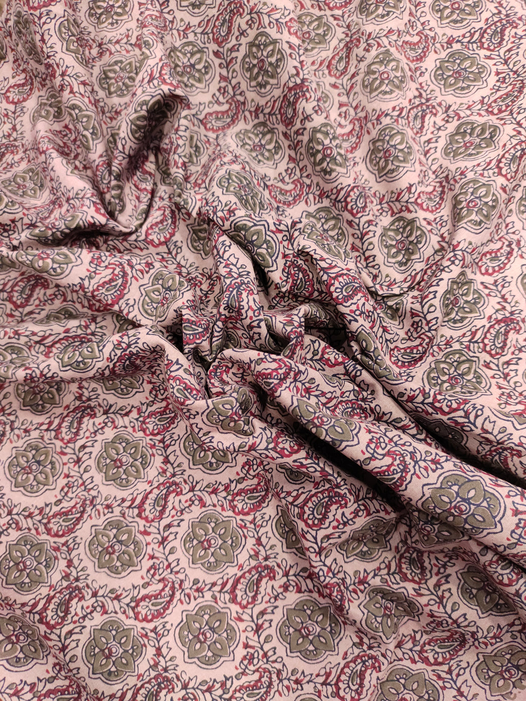 Cotton ajrak print on beige fabric with grey and maroon.