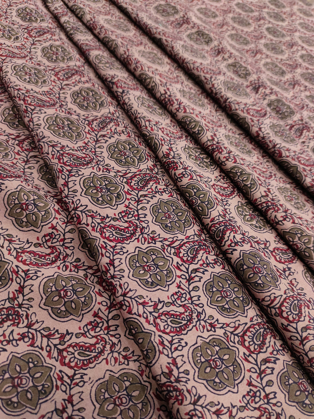 Cotton ajrak print on beige fabric with grey and maroon.