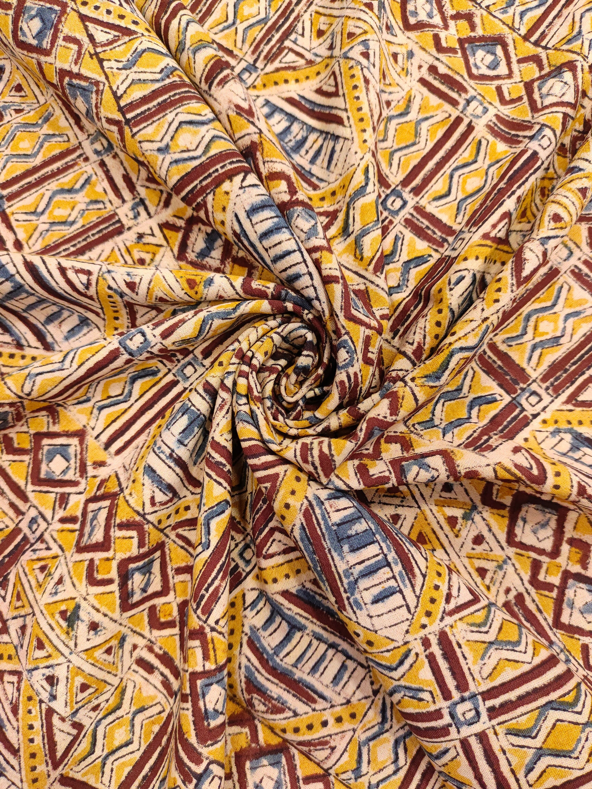 Mango yellow kalamkari with orange maroon and blue.