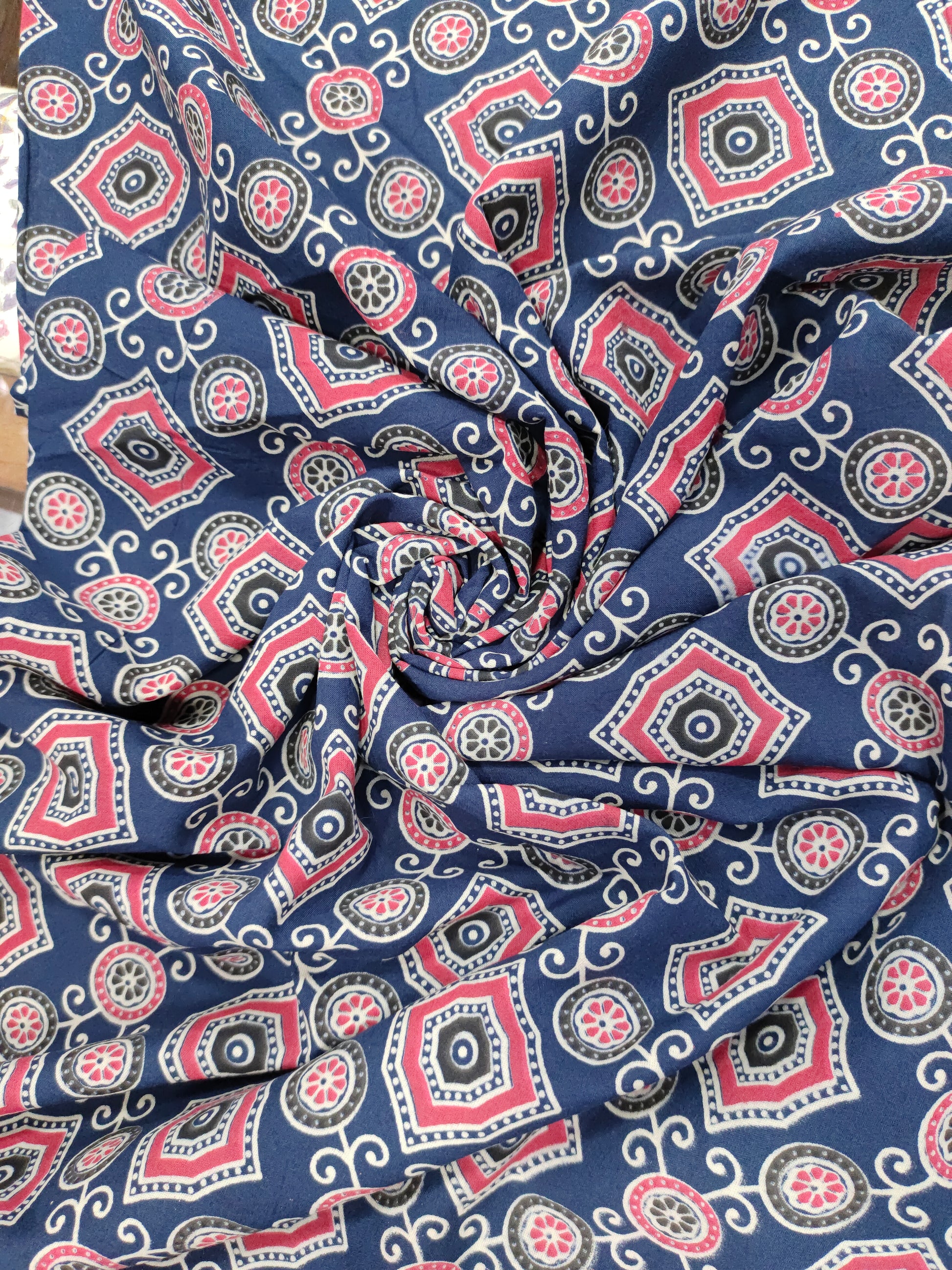 Blue ajrak print allover with red and white.
