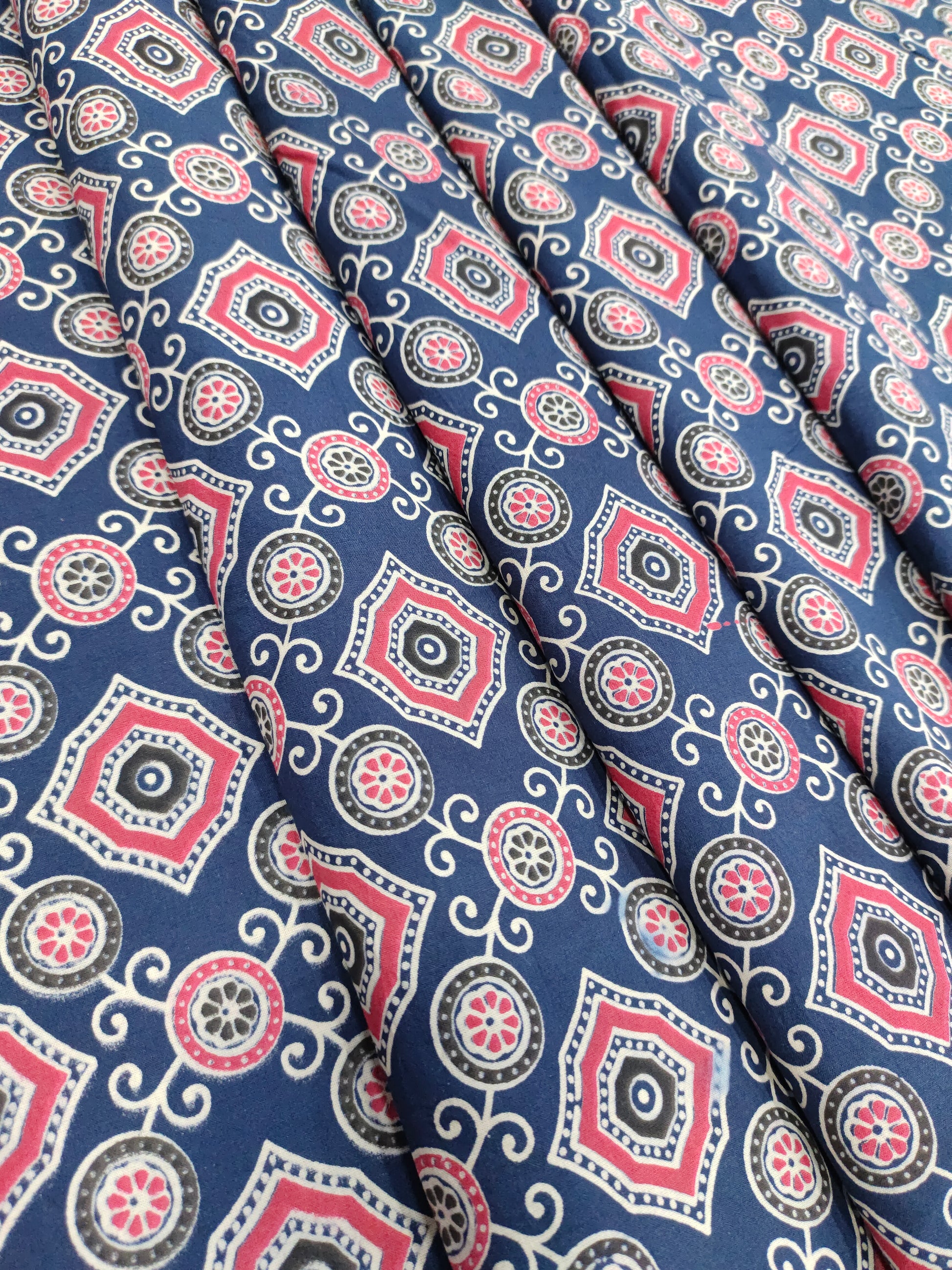 Blue ajrak print allover with red and white.