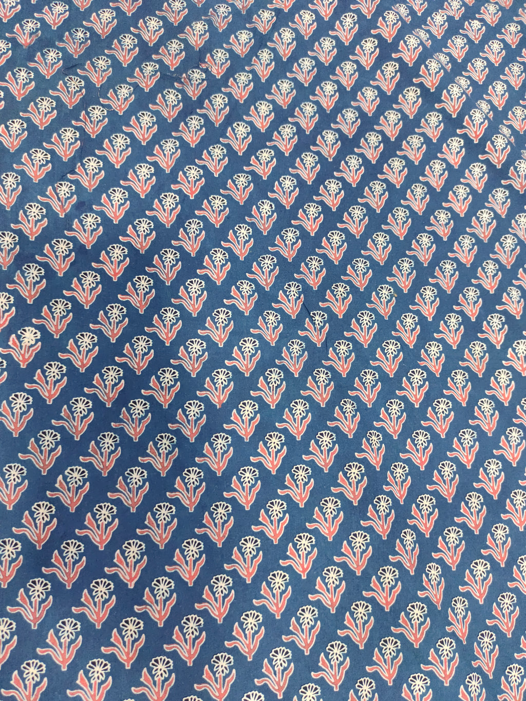 Blue base cotton fabric ajrak print with maroon and offwhite.