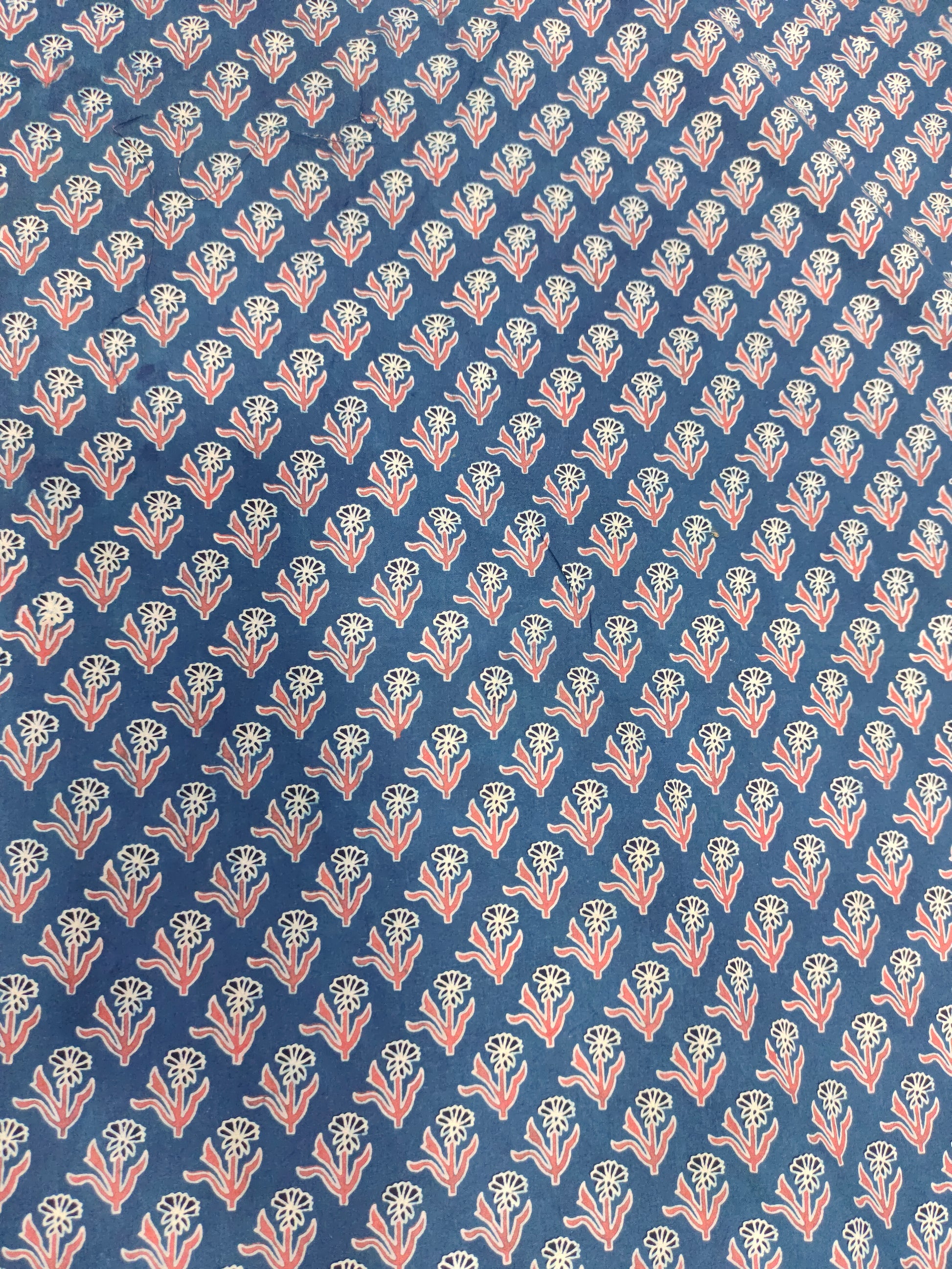 Blue base cotton fabric ajrak print with maroon and offwhite.