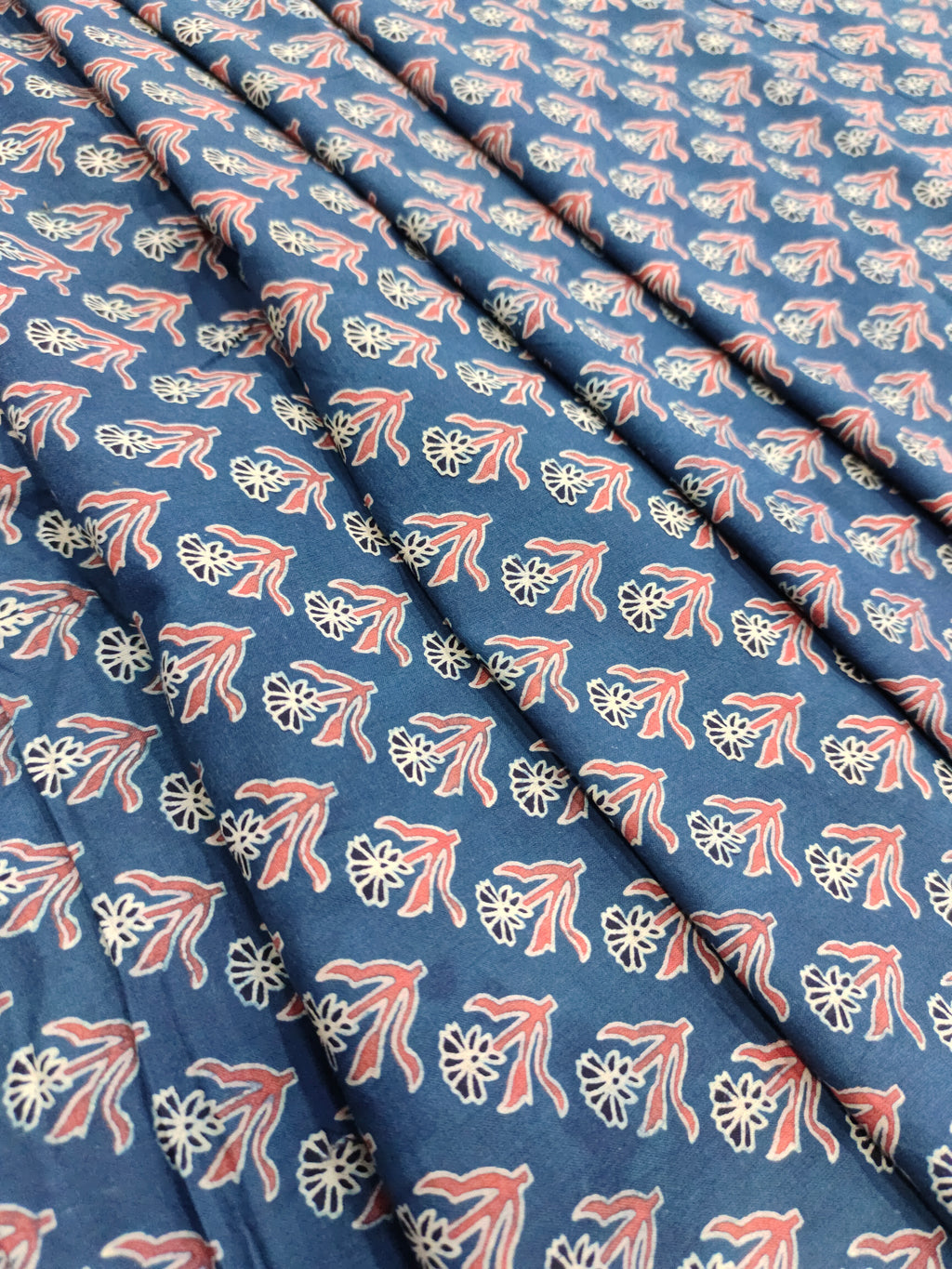 Blue base cotton fabric ajrak print with maroon and offwhite.