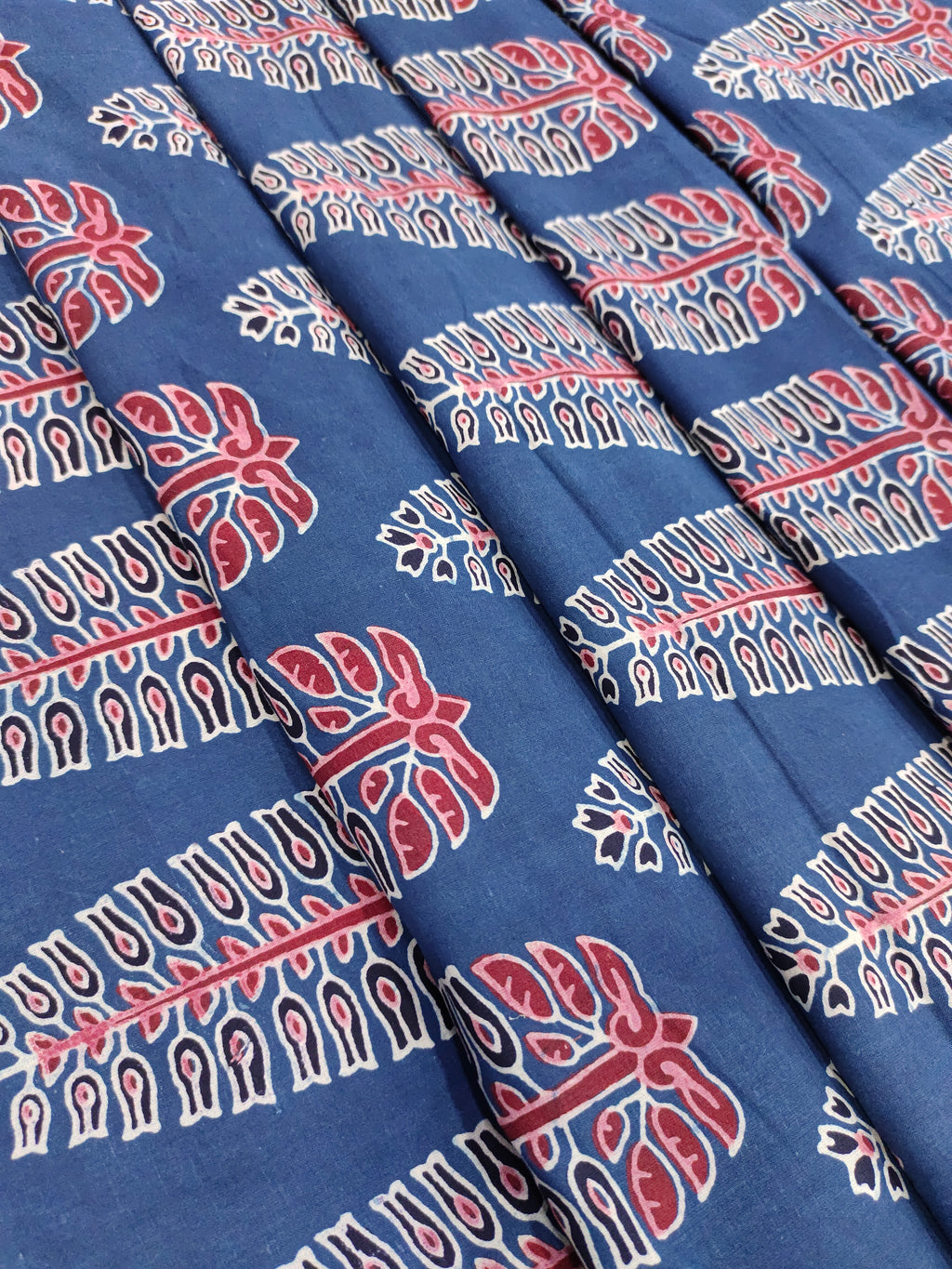 Ajrak print blue fabric with maroon traditional motif print.