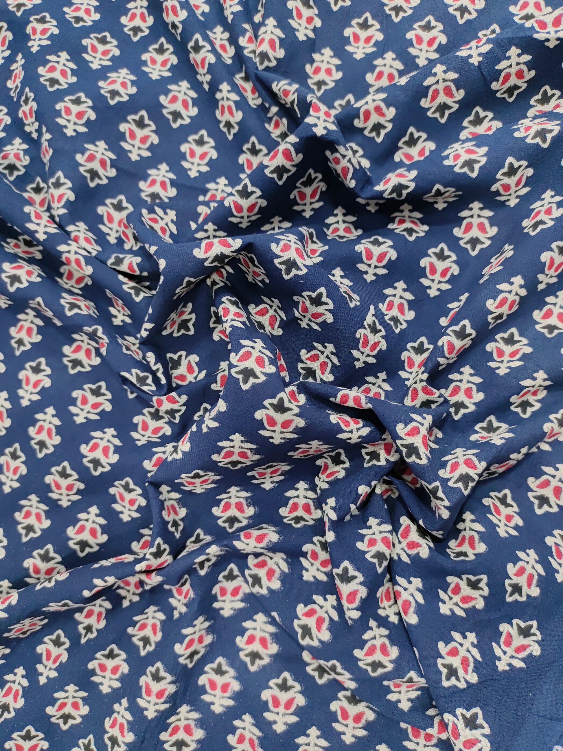 Blue cotton ajrak small butti with red and white.