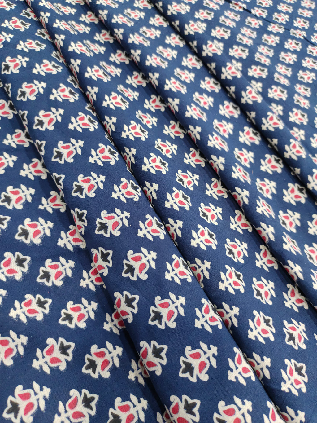 Blue cotton ajrak small butti with red and white.