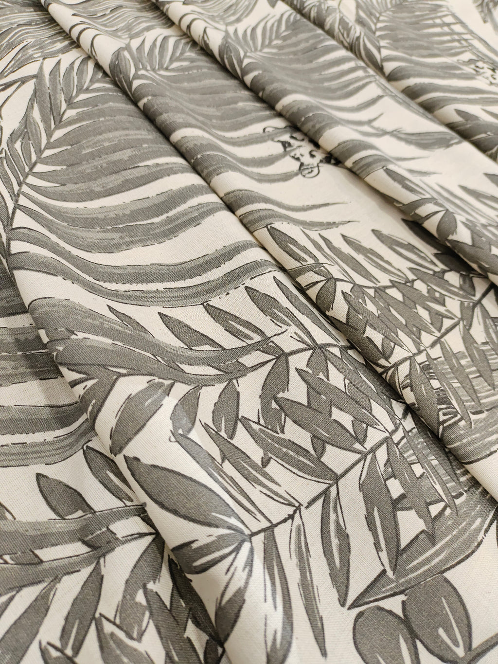 Cream flex cotton fabric jungle print with grey.