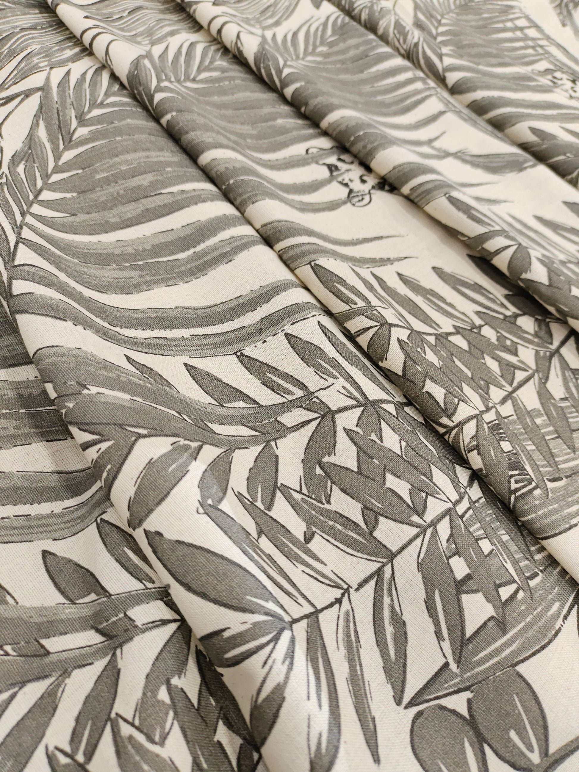 Cream flex cotton fabric jungle print with grey.