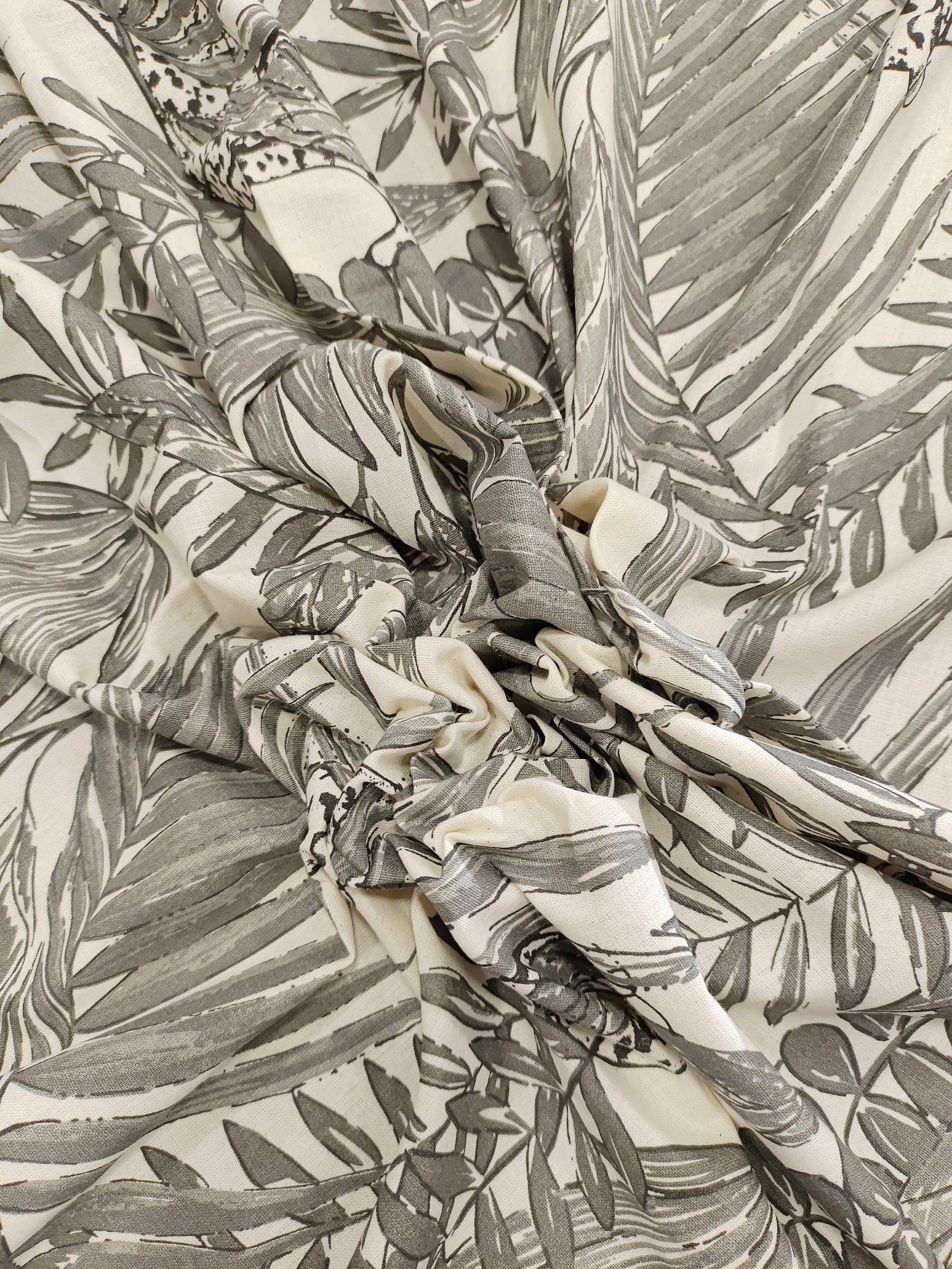 Cream flex cotton fabric jungle print with grey.