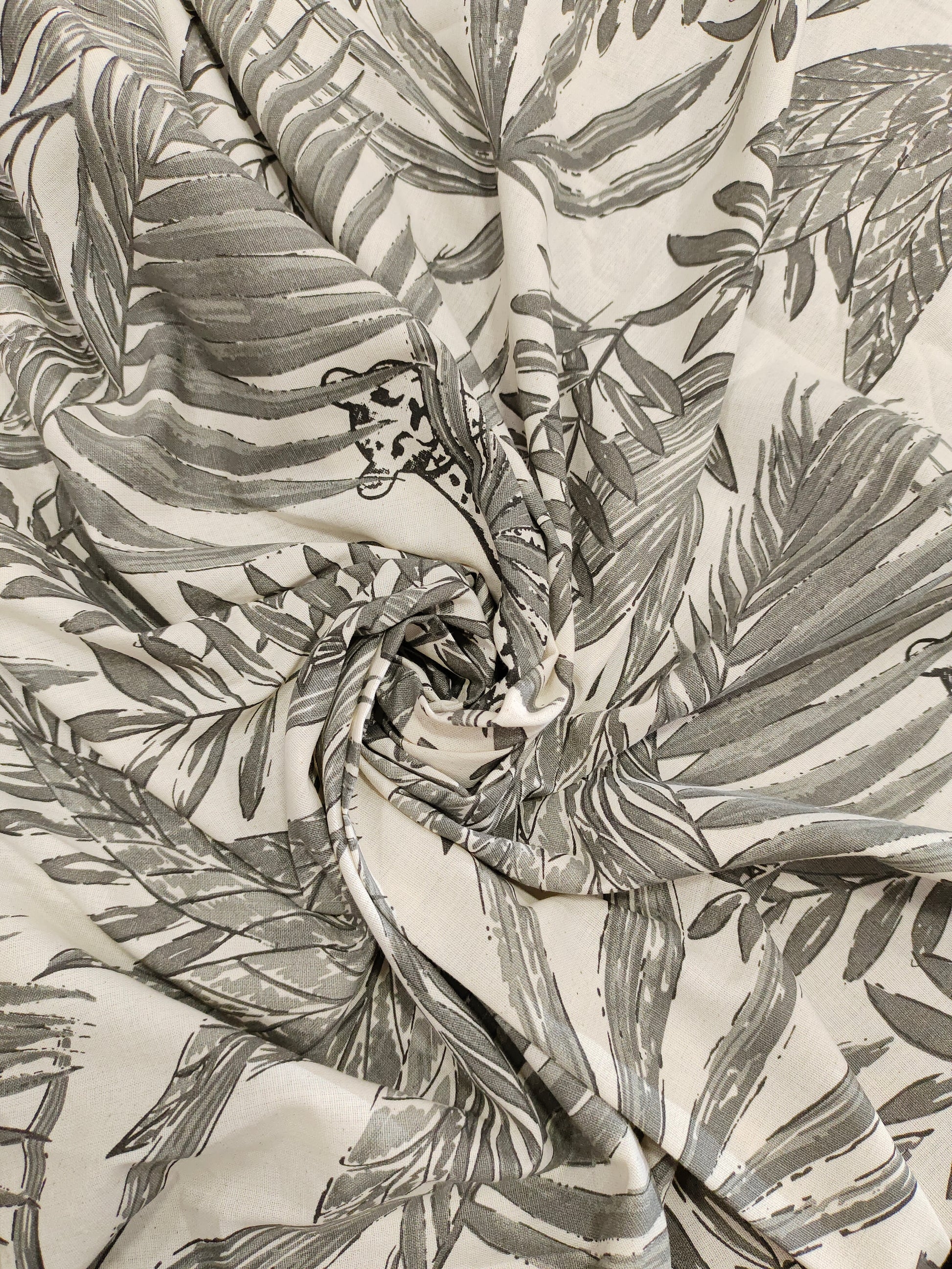 Cream flex cotton fabric jungle print with grey.