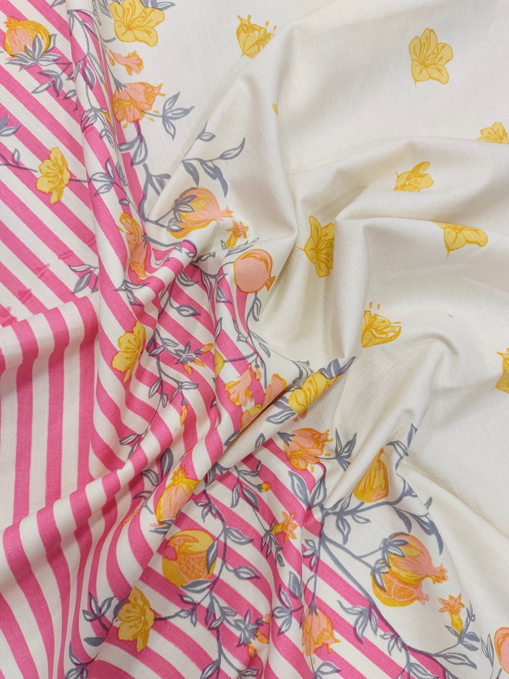Cotton flex daman print with pink and yellow.