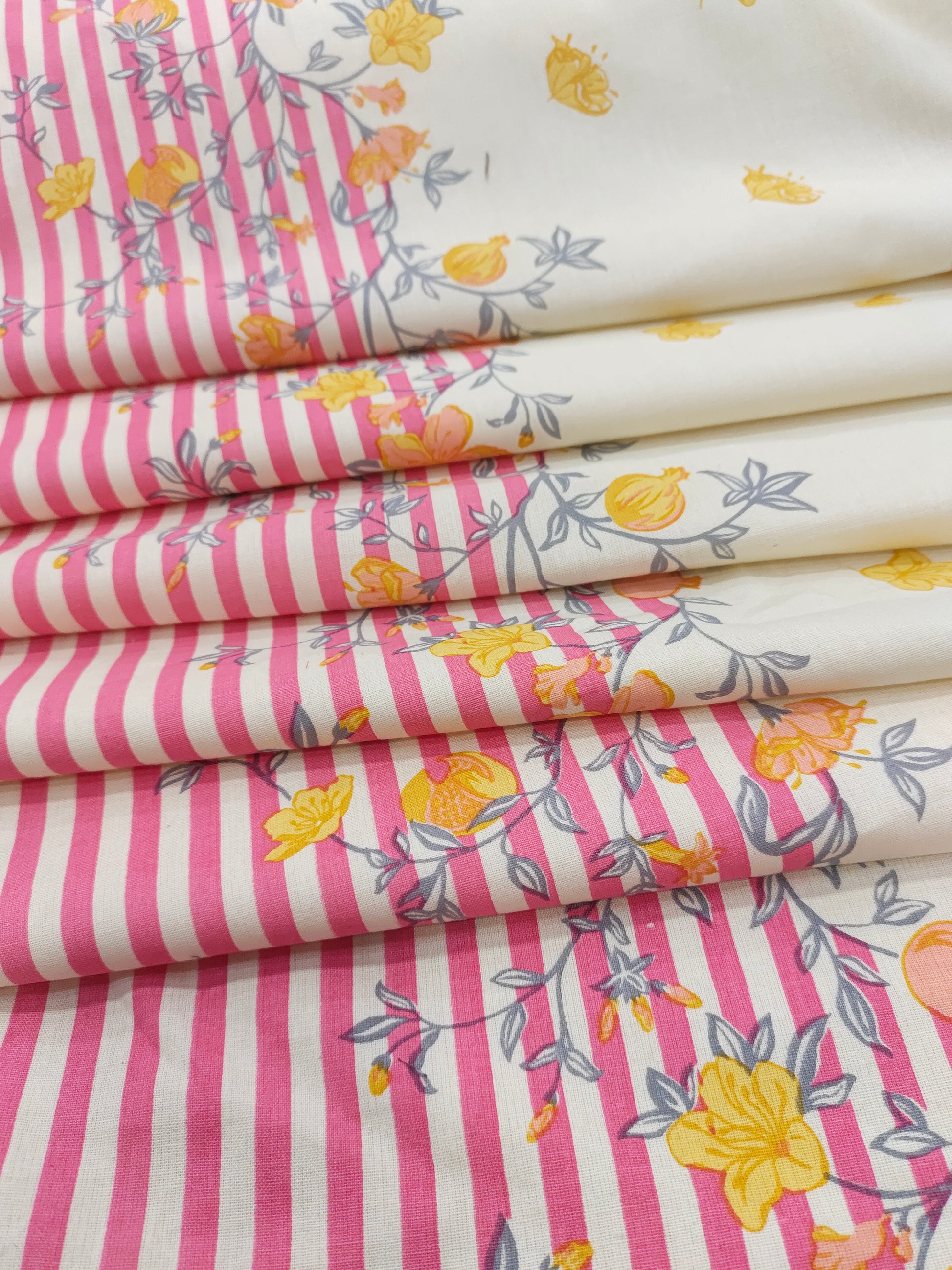Cotton flex daman print with pink and yellow.