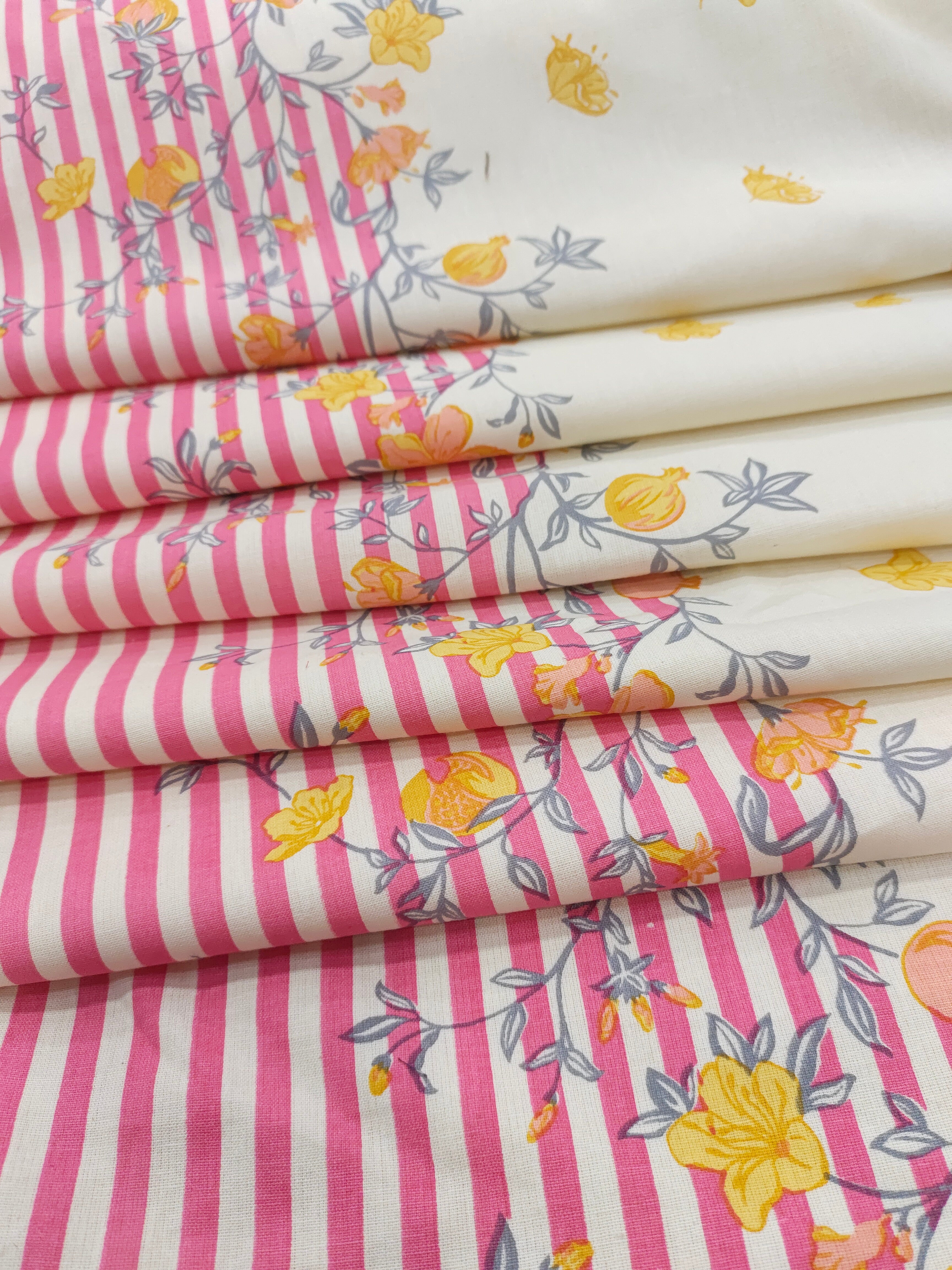 Cotton flex daman print with pink and yellow.