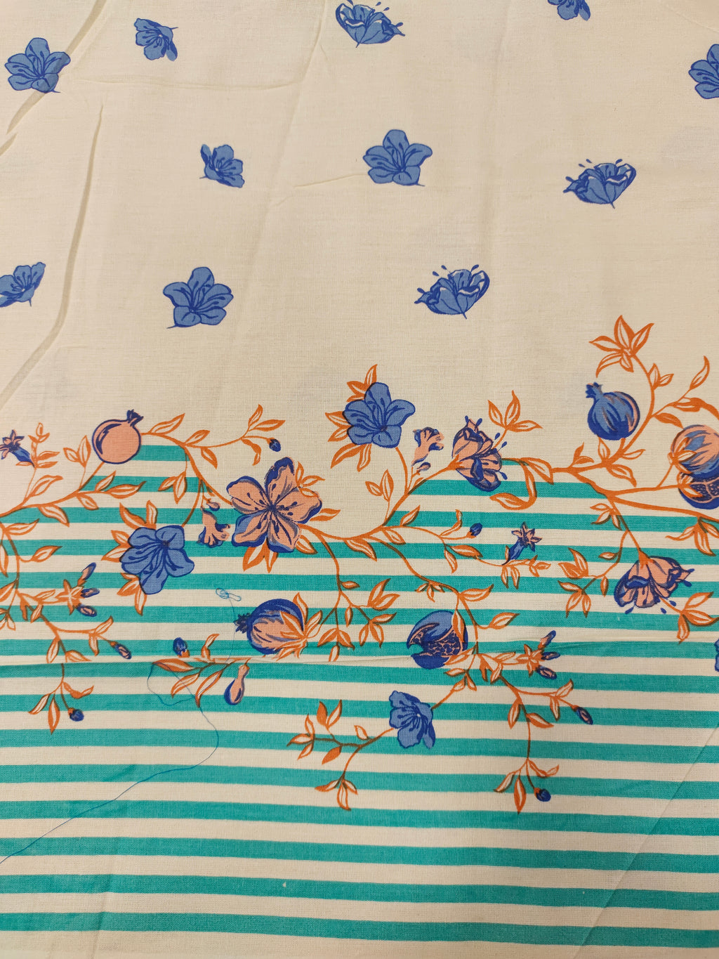 Cream flex cotton daman print green blue and orange.