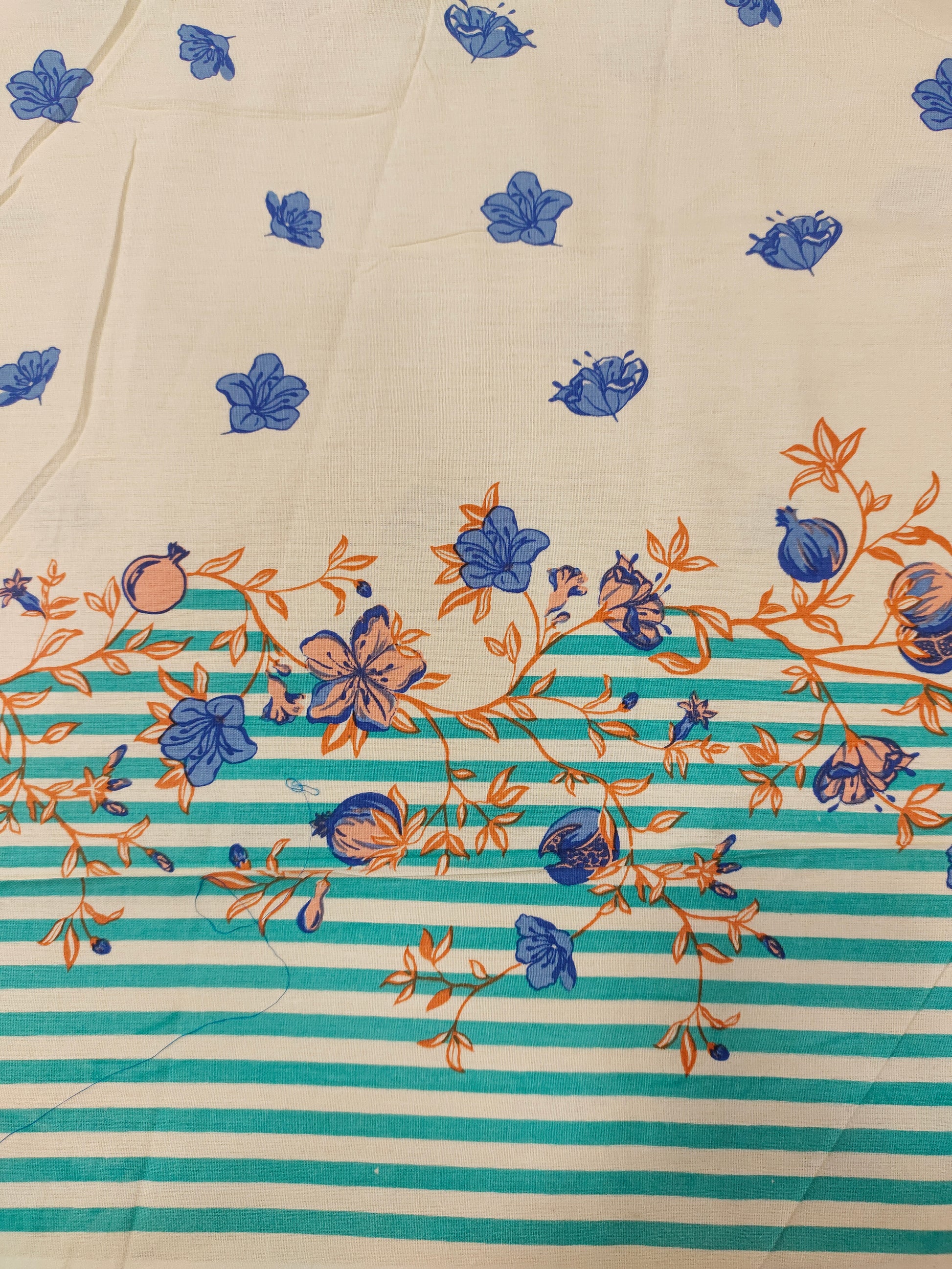 Cream flex cotton daman print green blue and orange.