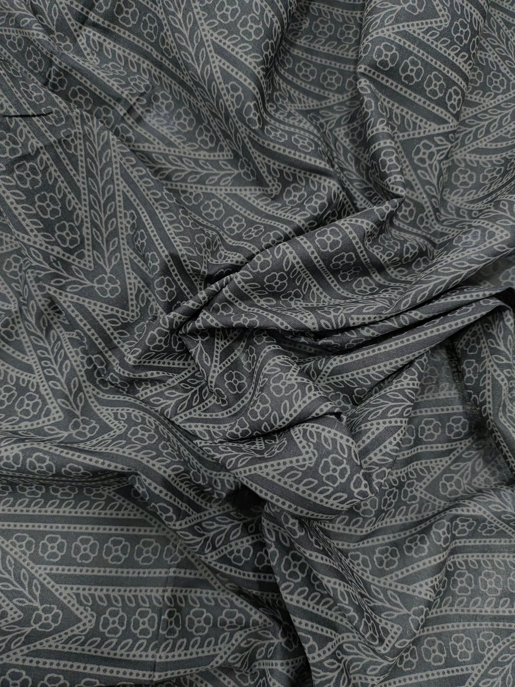 Black cotton fabric with grey stripes print.