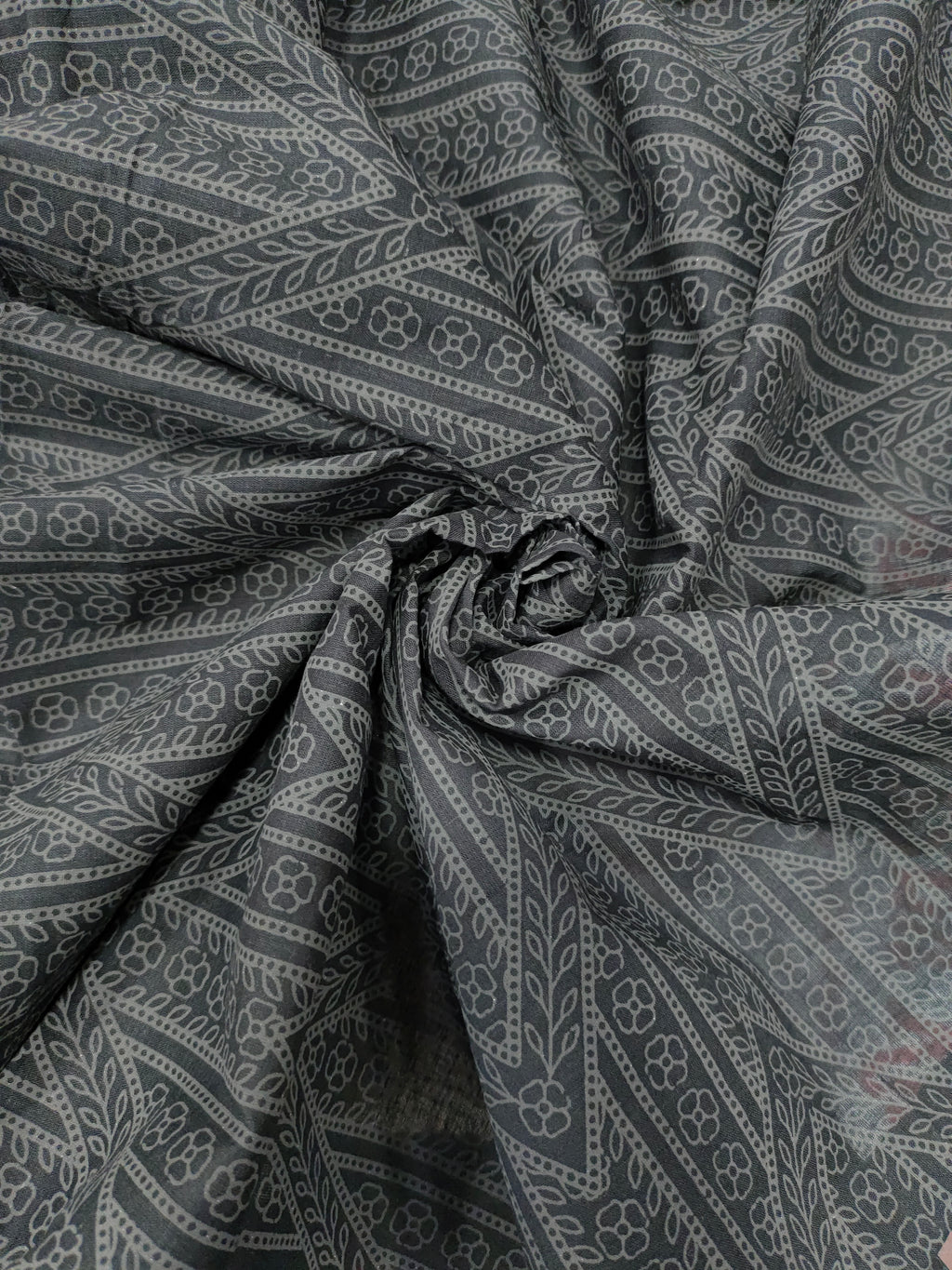 Black cotton fabric with grey stripes print.