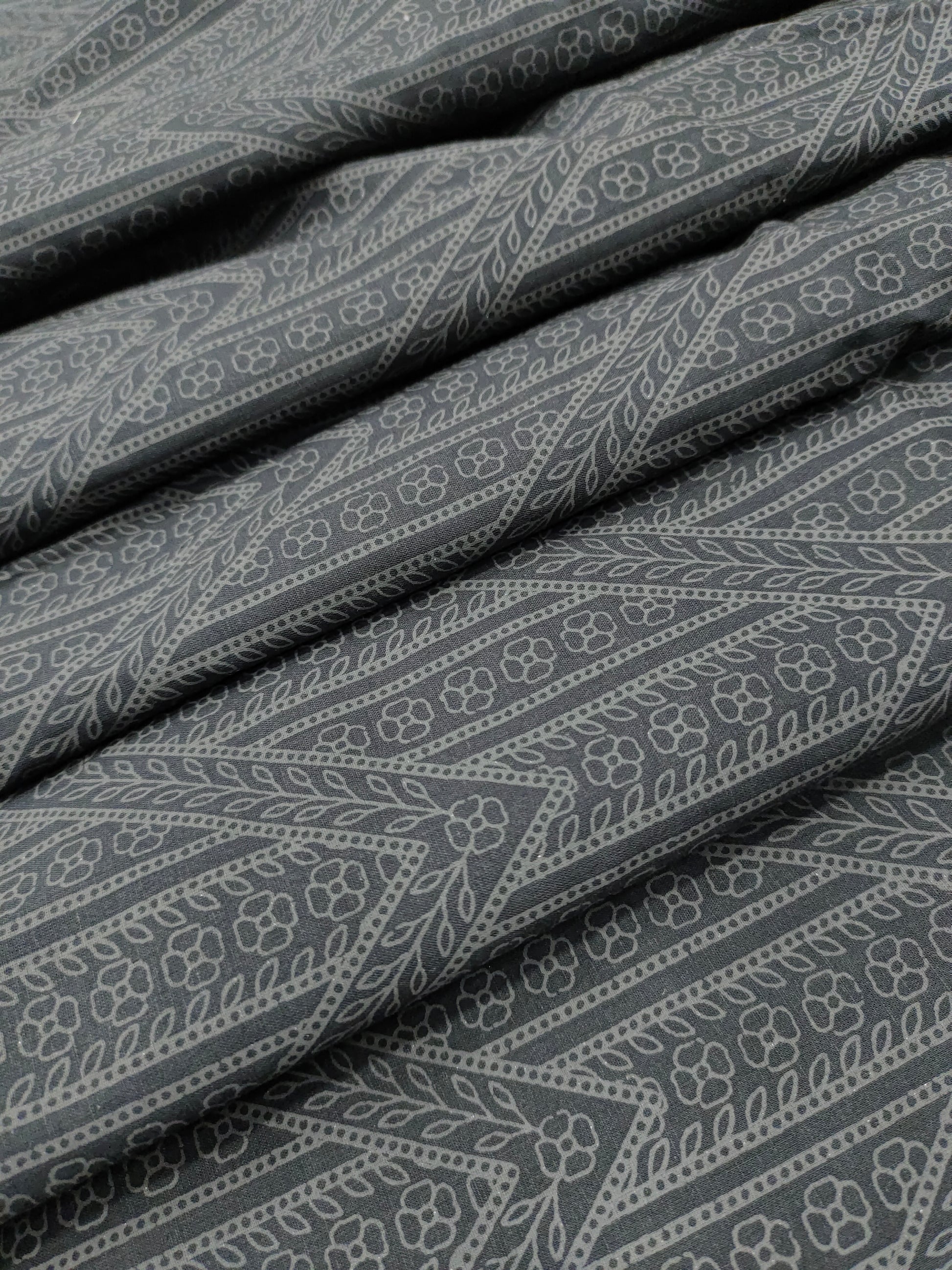 Black cotton fabric with grey stripes print.