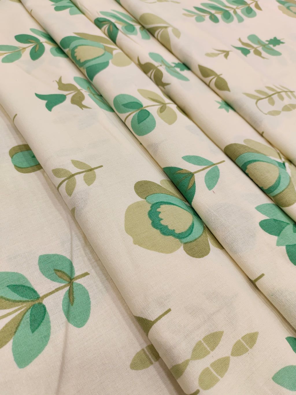 Cream cotton flex big floral print wit 2 colors of green.