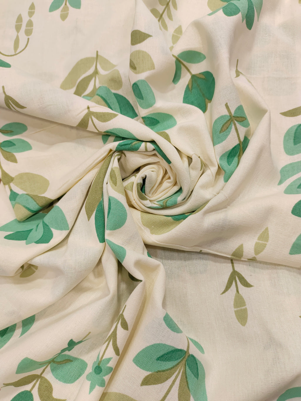 Cream cotton flex big floral print wit 2 colors of green.