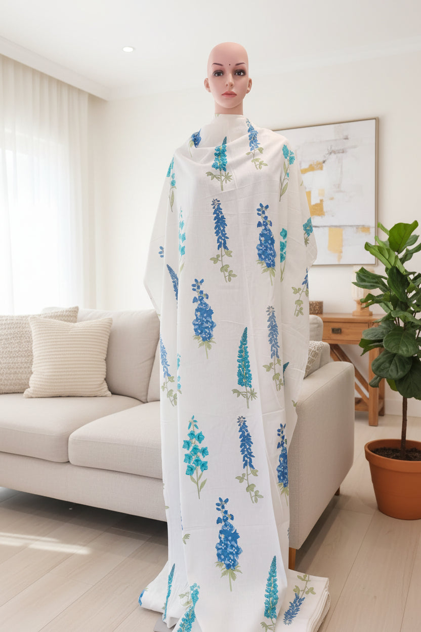 Cream cotton flex fabric stem type print with blue and green.