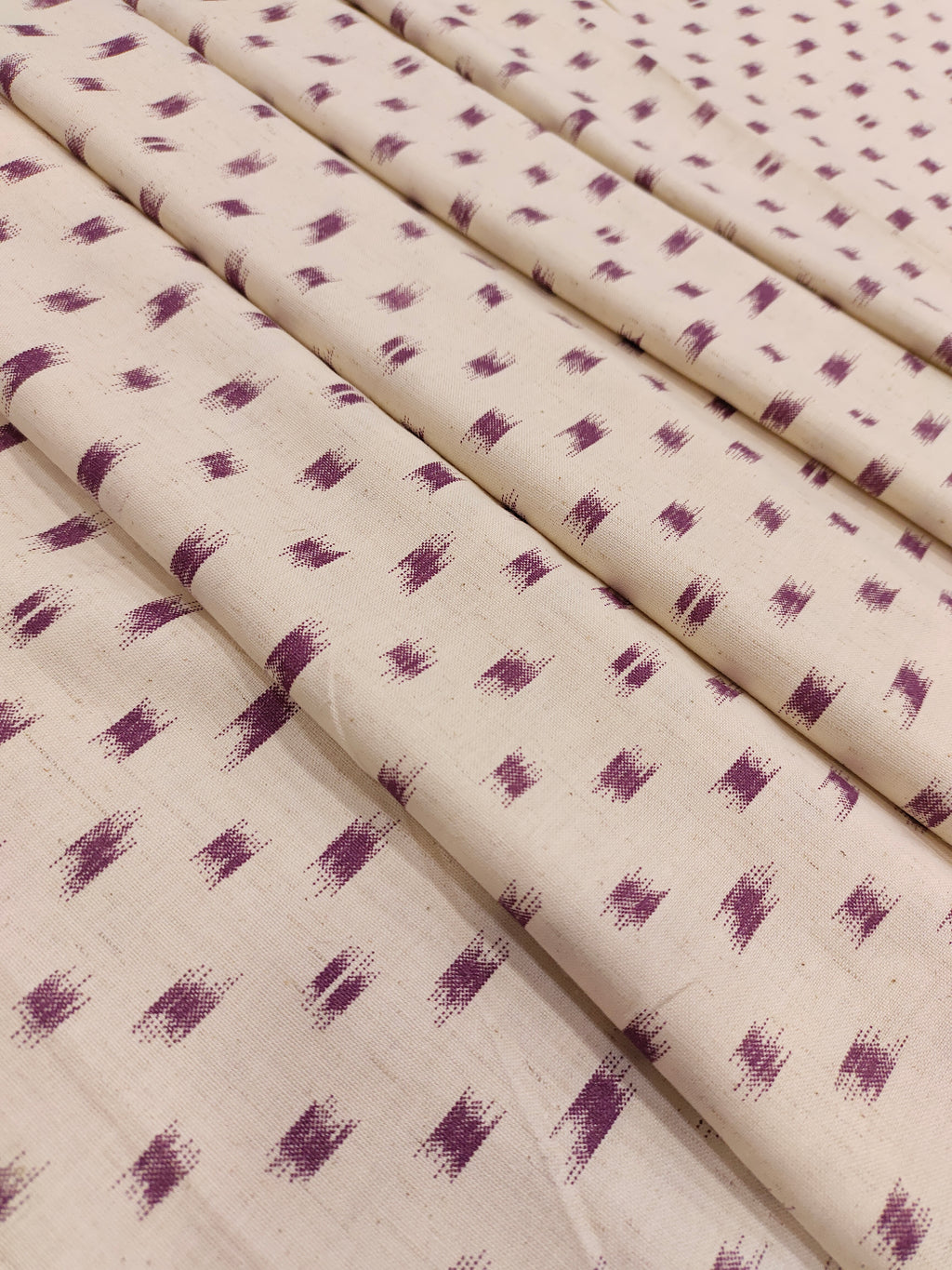 Cream cotton flex with mauve color ikkat print.