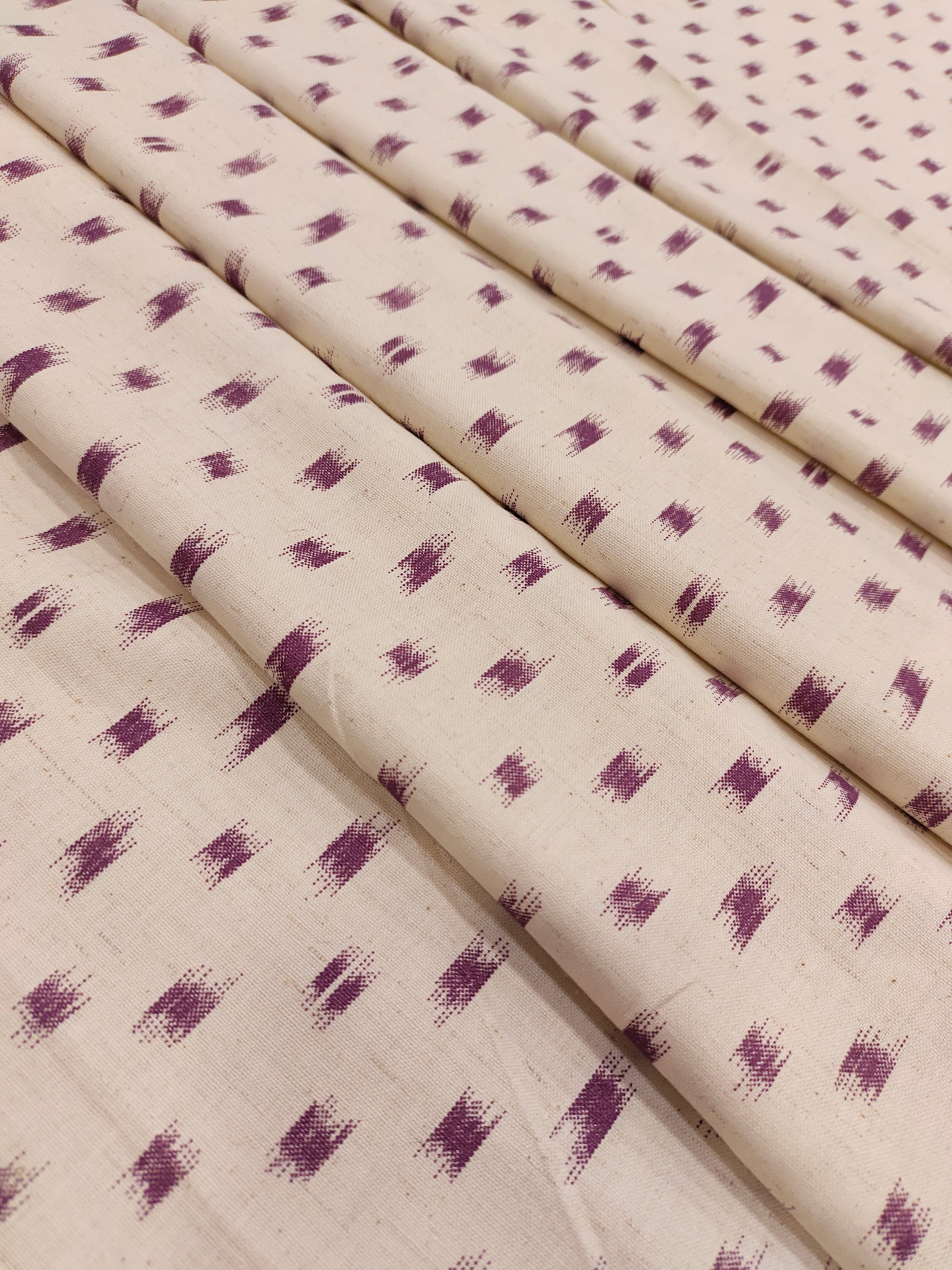 Cream cotton flex with mauve color ikkat print.