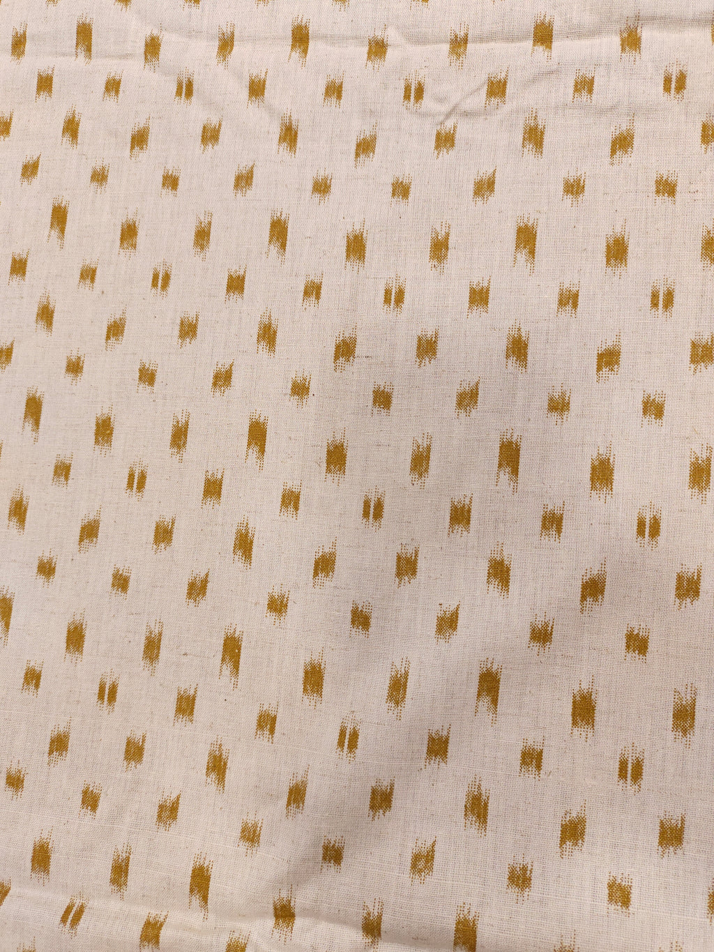 Cream cotton flex fabric mustard ikkat print.