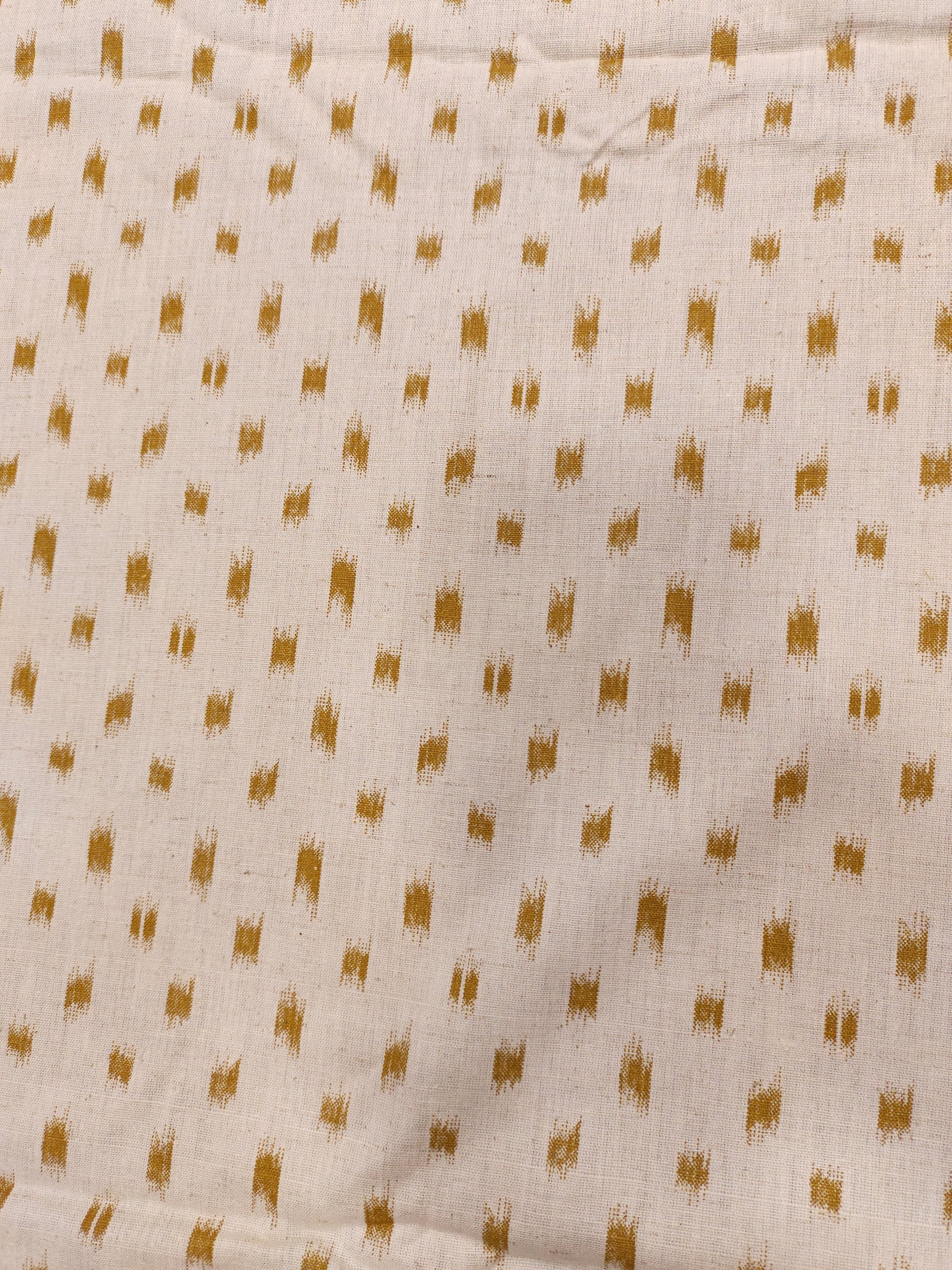 Cream cotton flex fabric mustard ikkat print.