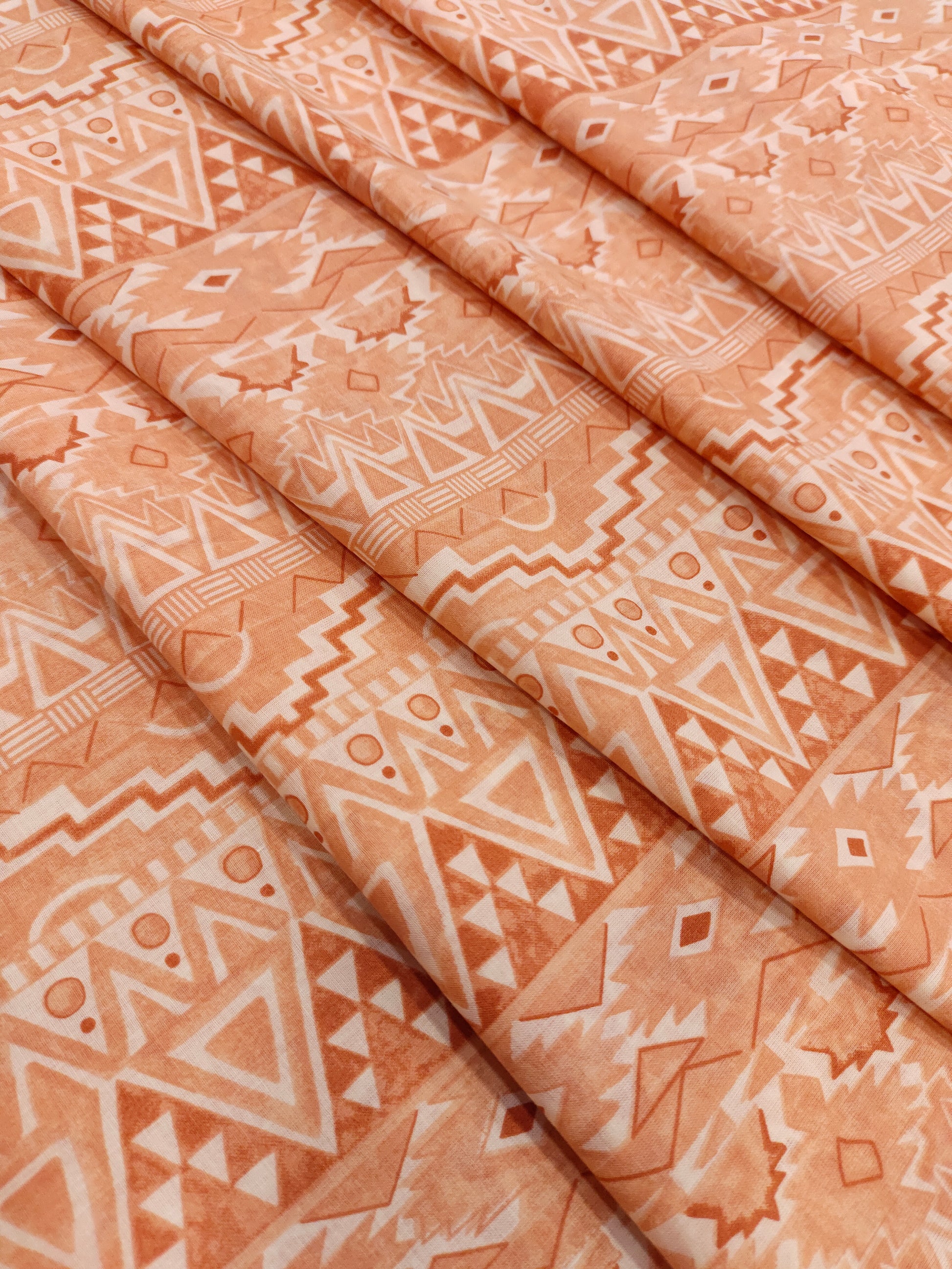 Cream fabric with broad peach stripes print.