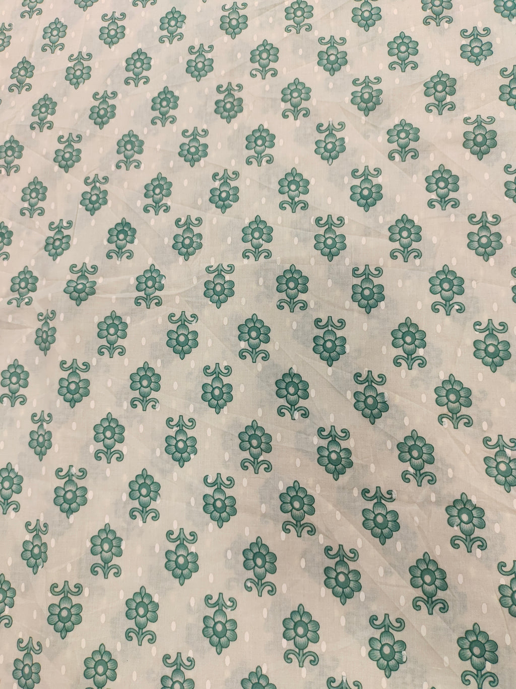 Cream cotton base floral print with green.