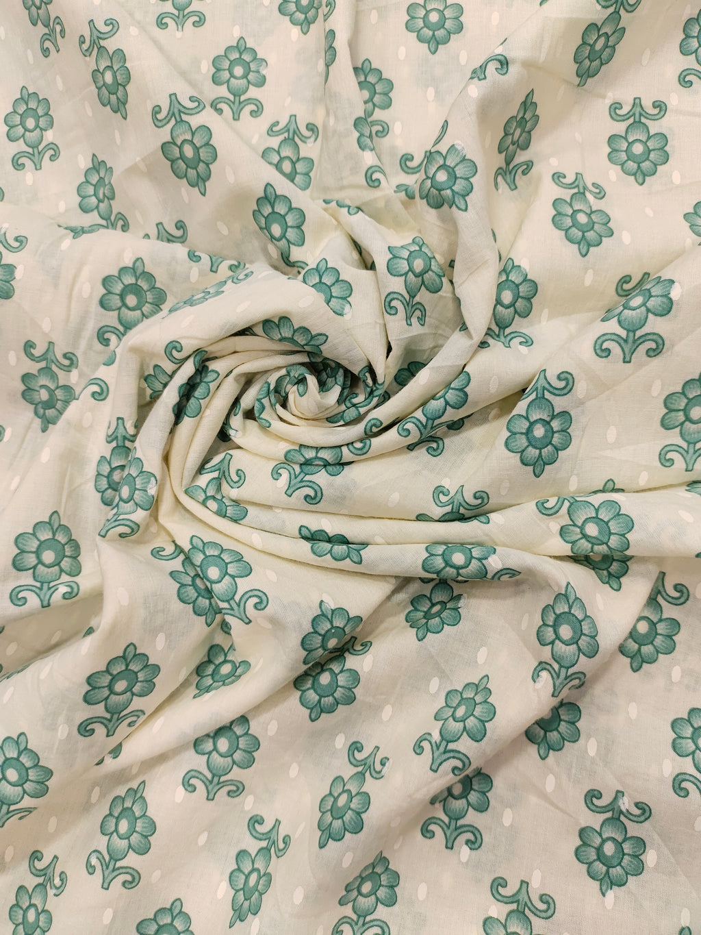Cream cotton base floral print with green.