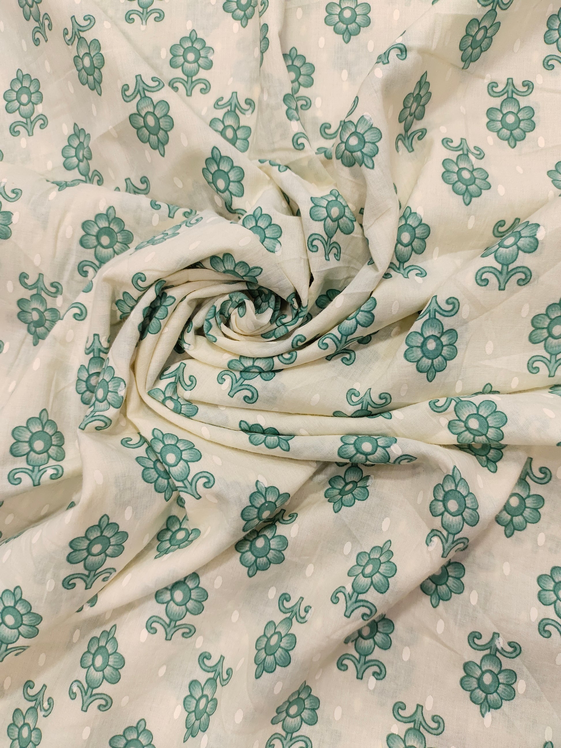 Cream cotton base floral print with green.