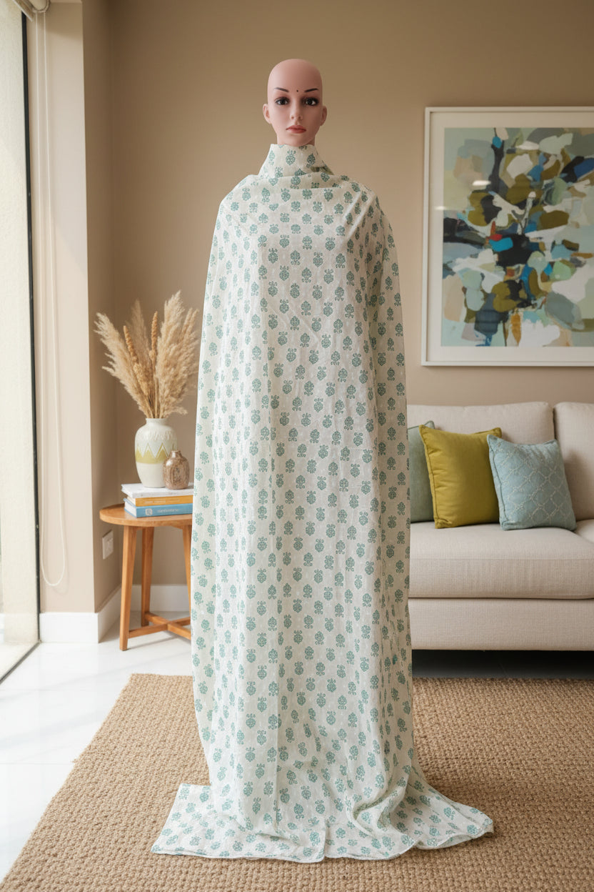 Cream cotton base floral print with green.