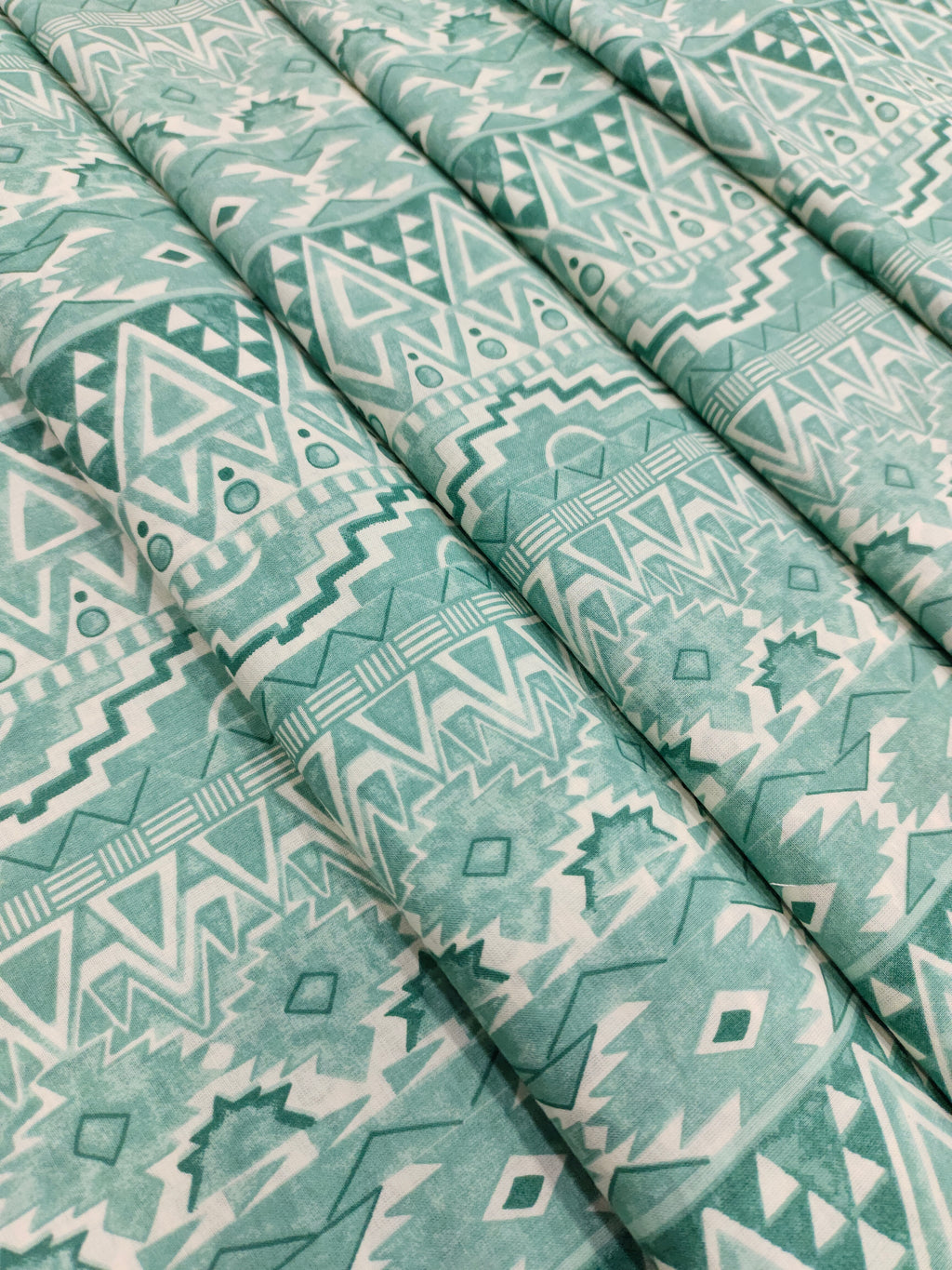 Cream base cotton fabric stripes with pista green and different styles.