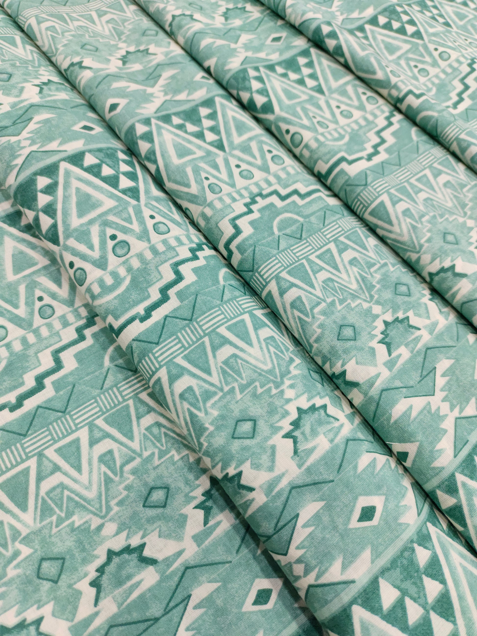 Cream base cotton fabric stripes with pista green and different styles.