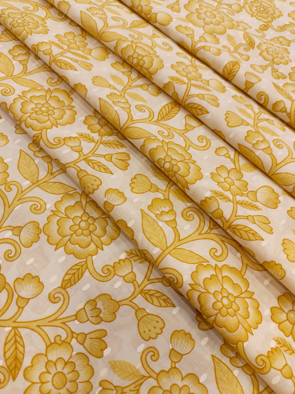 Off white cotton fabric print with yellow jaal.