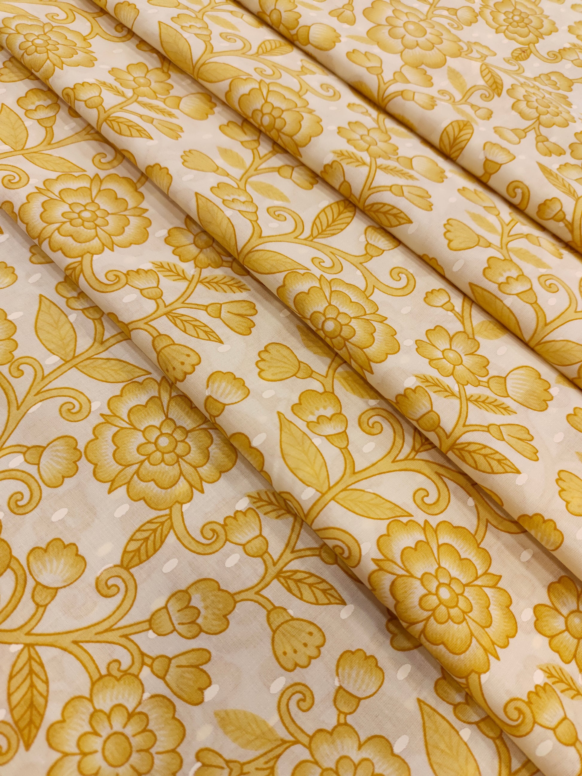 Off white cotton fabric print with yellow jaal.