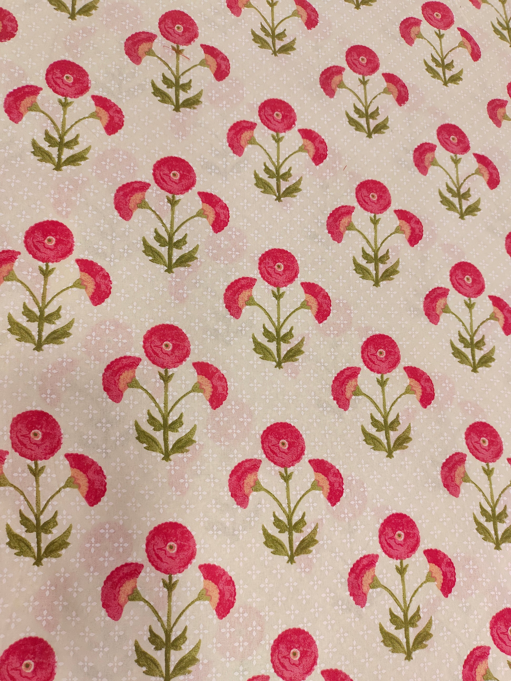 Cream cotton flex fabric with pink and green floral print.