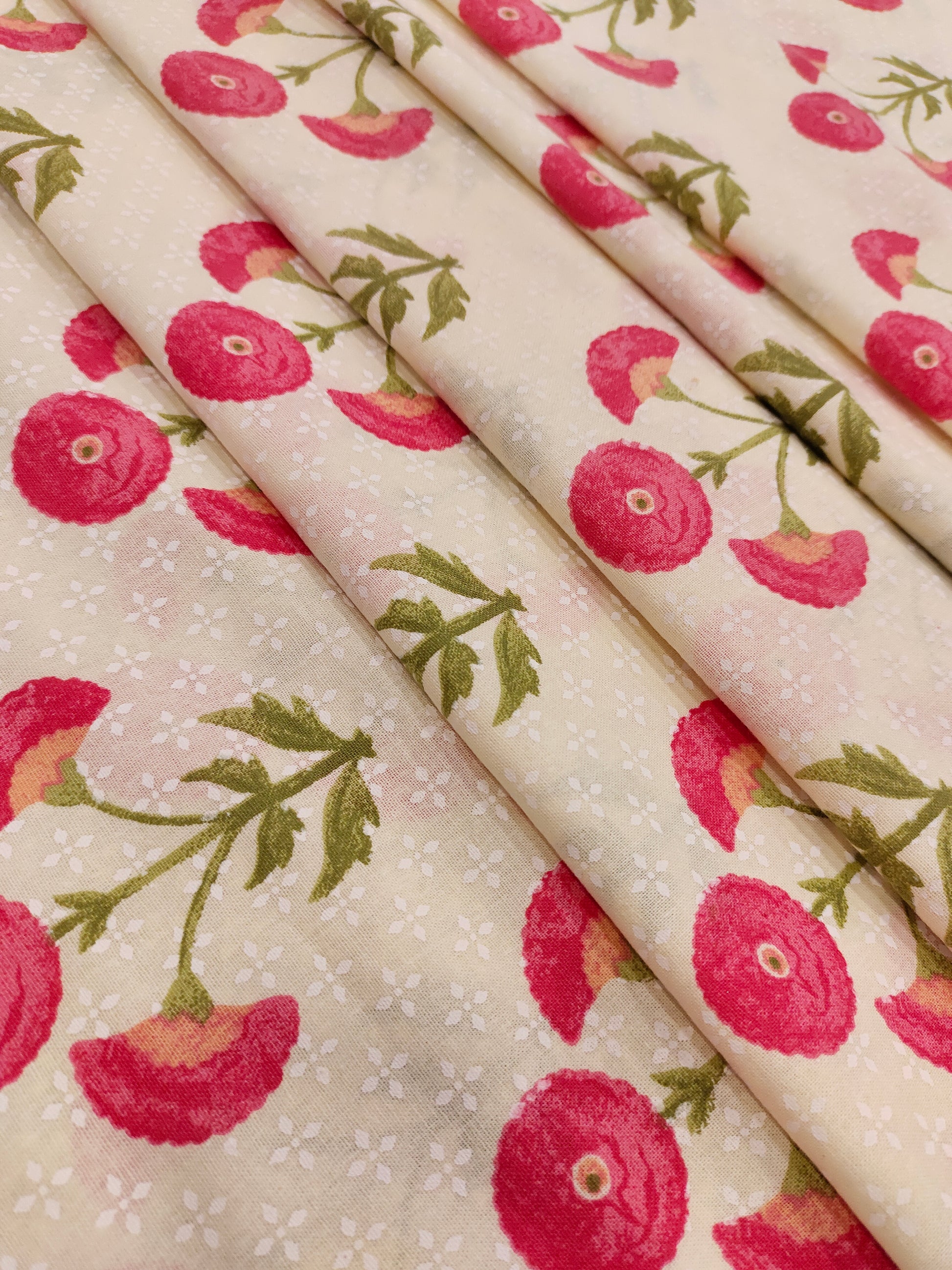Cream cotton flex fabric with pink and green floral print.