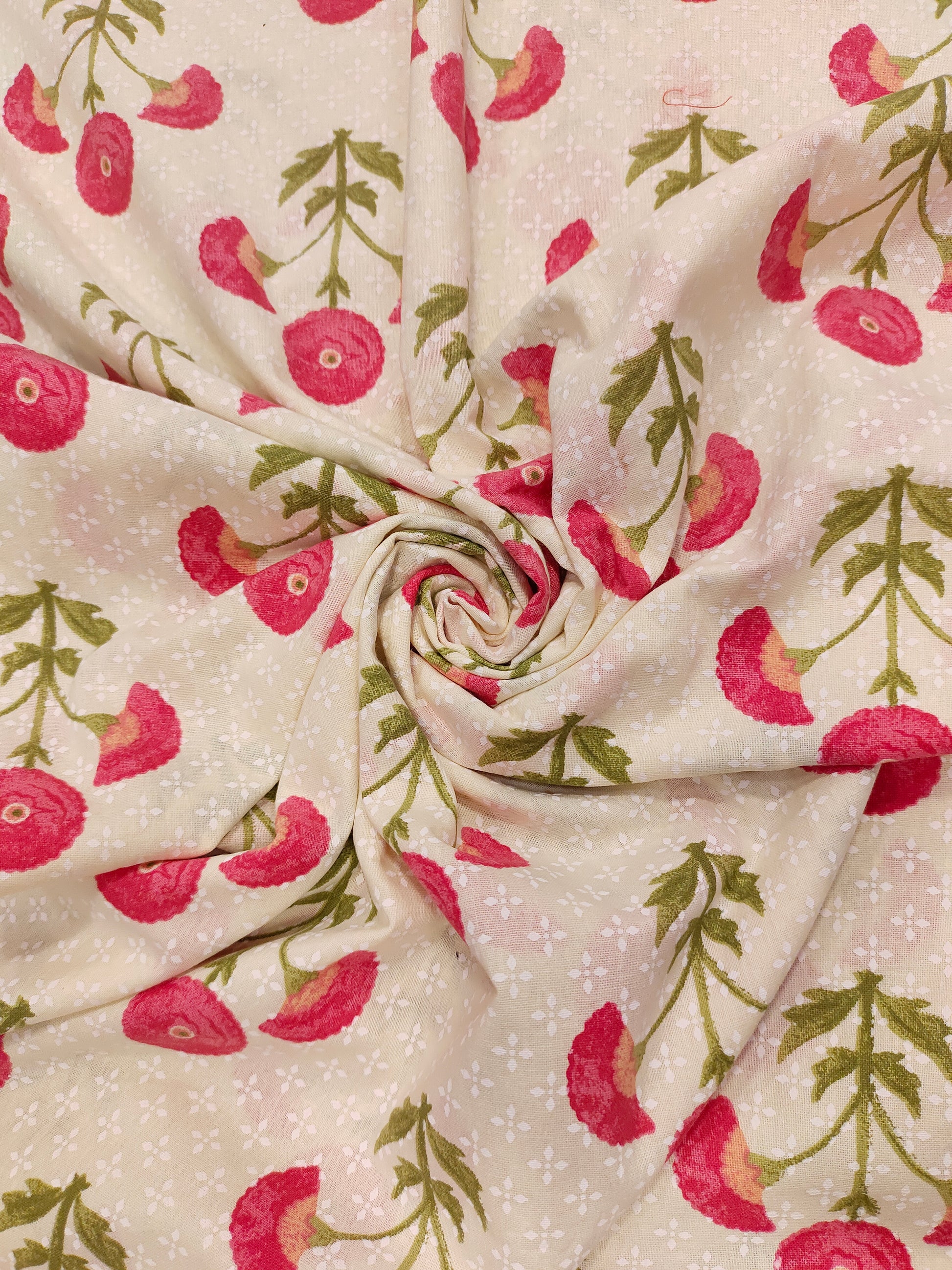 Cream cotton flex fabric with pink and green floral print.