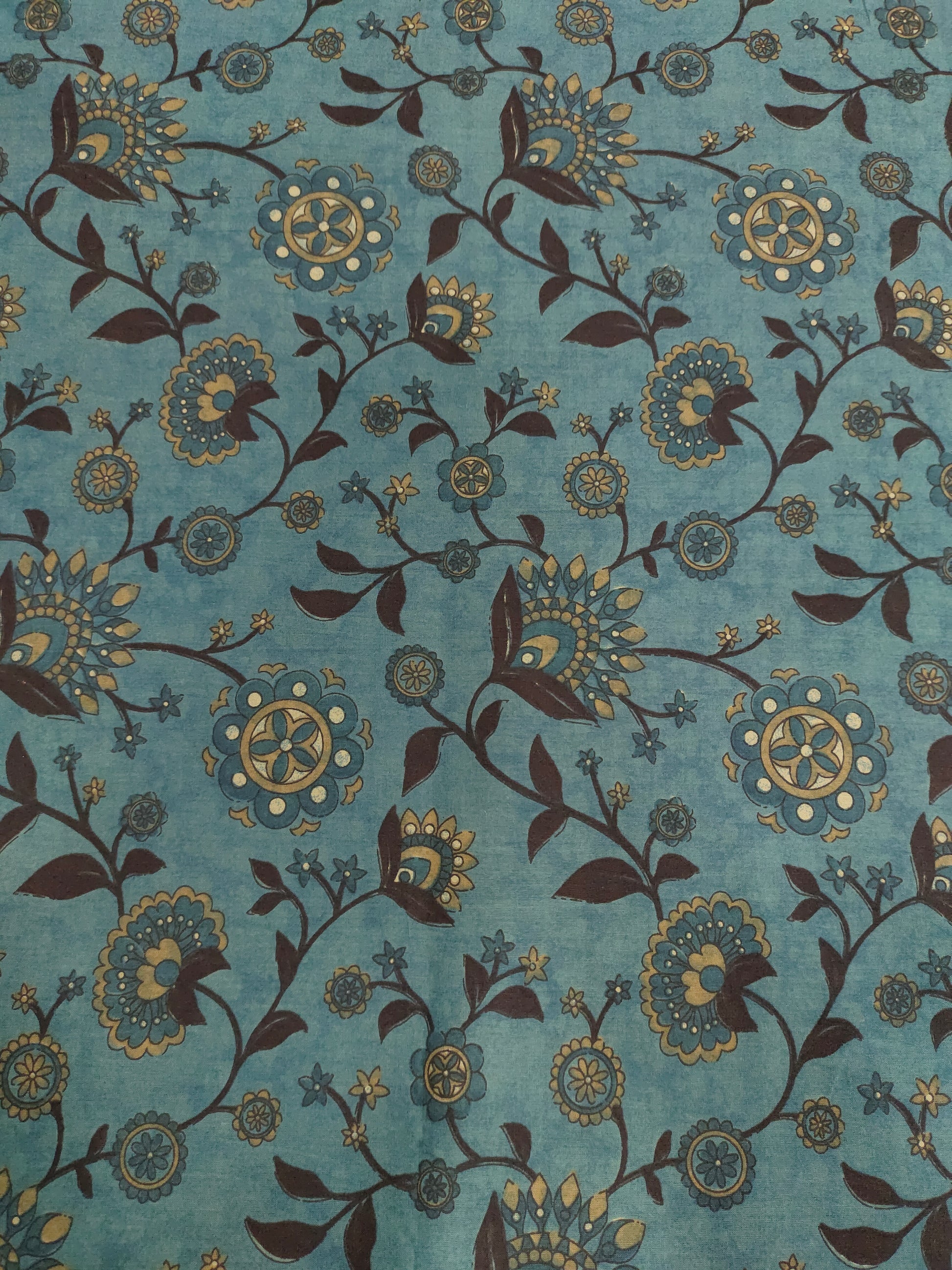 Cotton peacock green fabric jaal print with black maroon mustard.