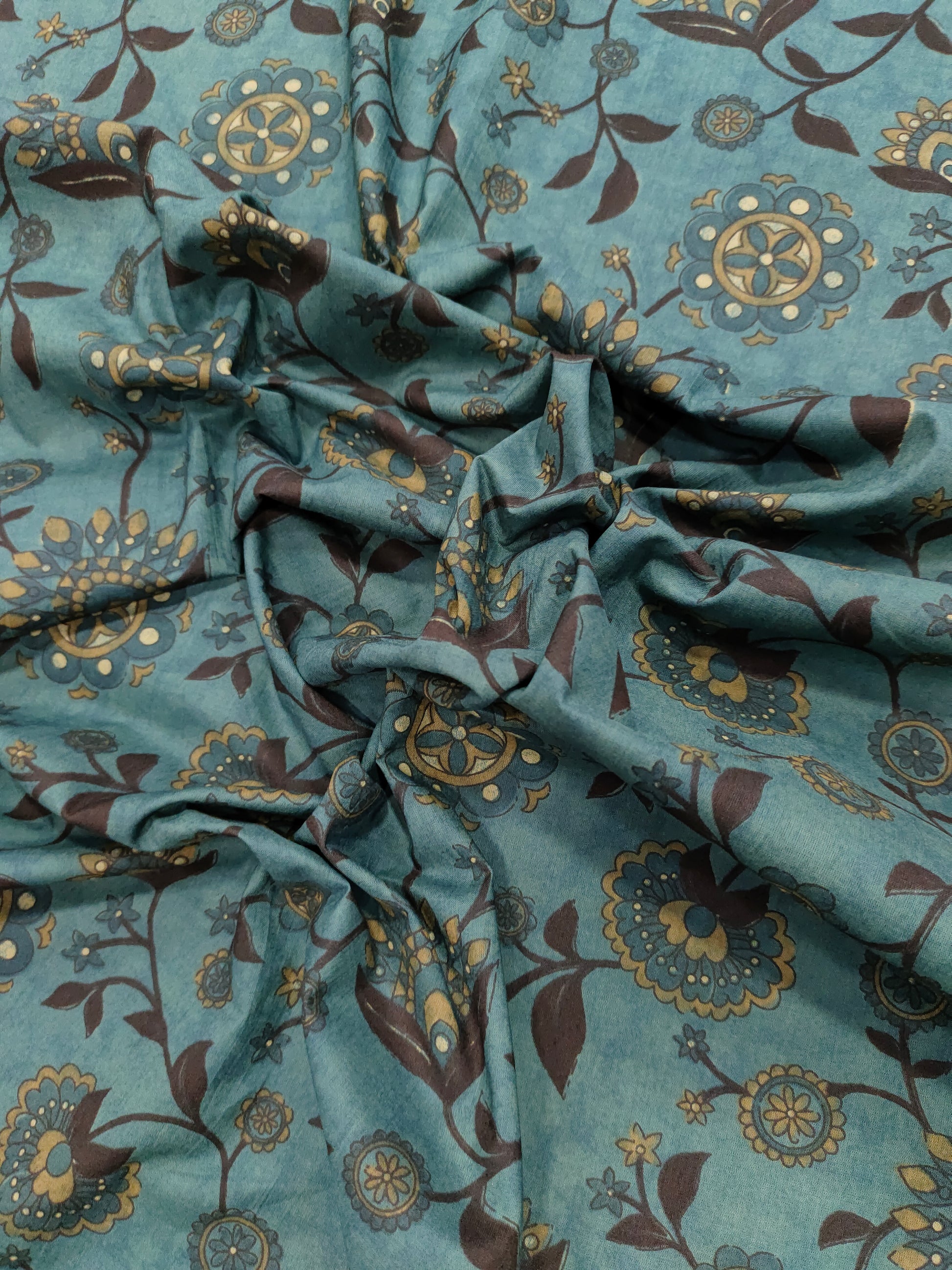 Cotton peacock green fabric jaal print with black maroon mustard.
