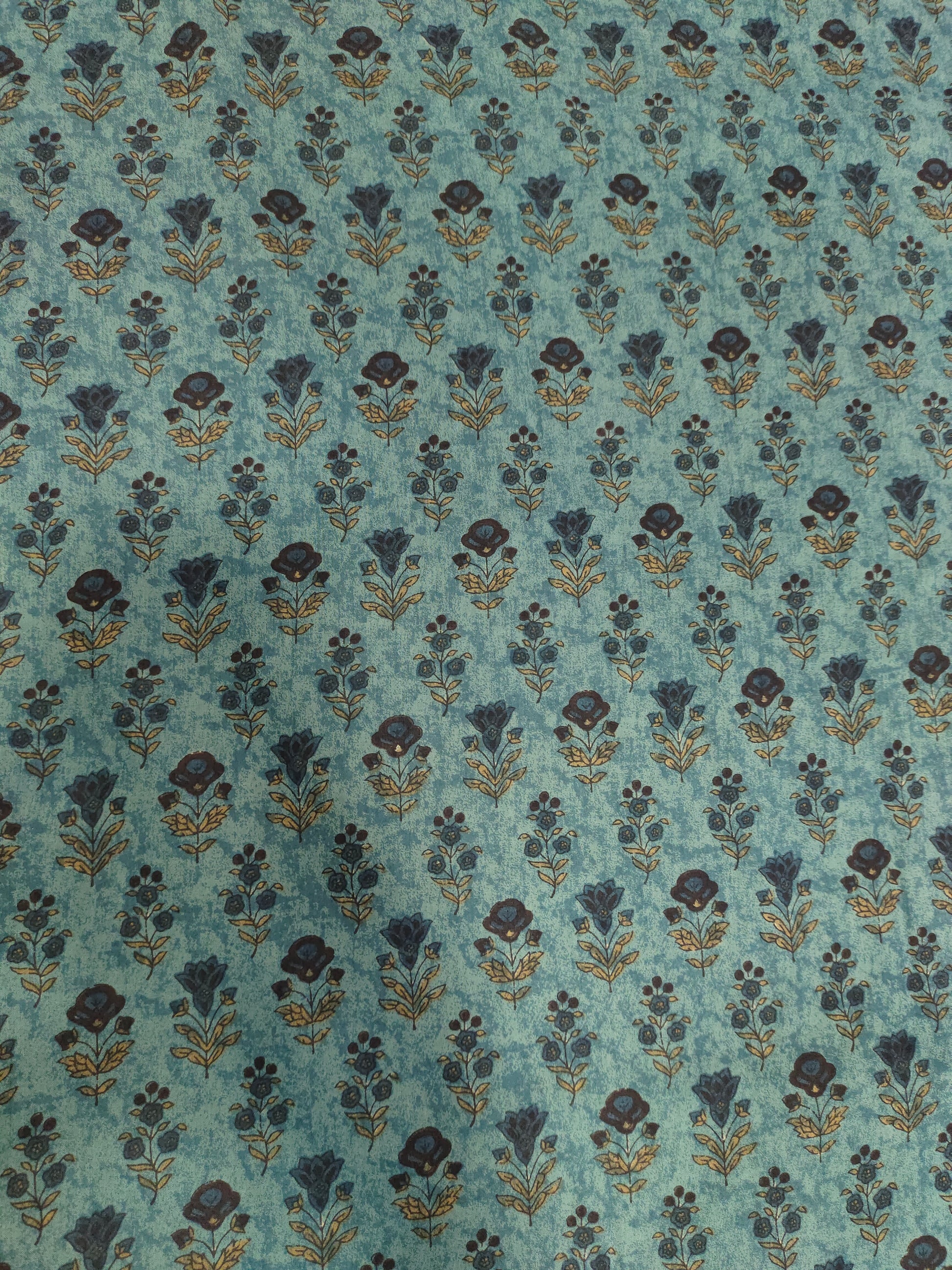 Cotton 60s bagh print butti on peacock green color.